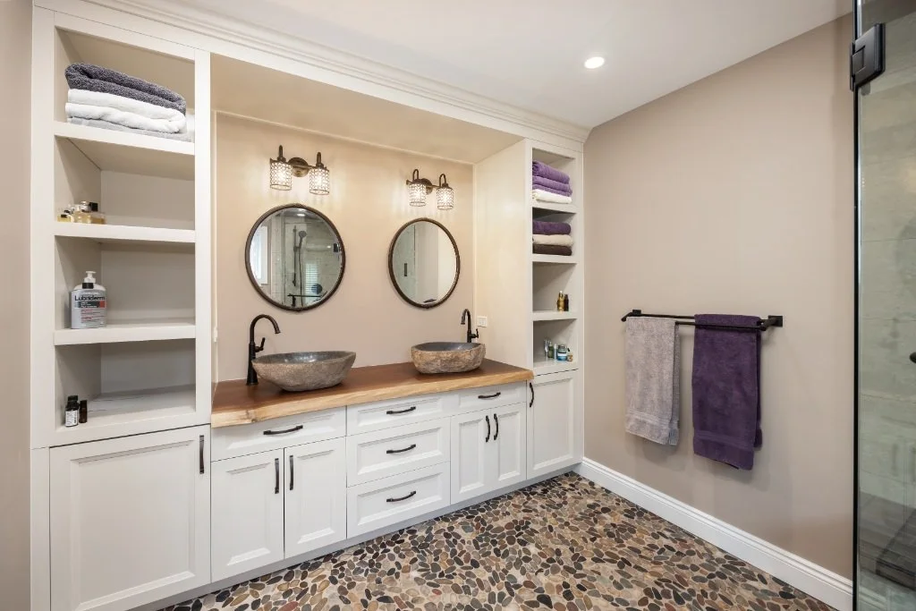 Ensuite bathroom featuring vinyl flooring and walk-in shower, offering a warm, slip-resistant flooring solution for bathrooms.