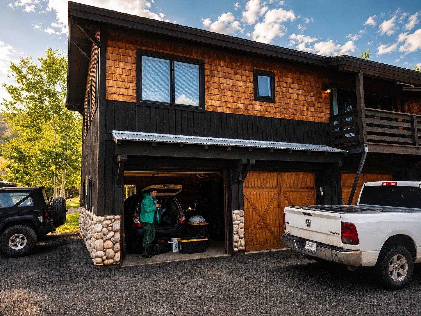 Chef Alayah unloading her car in the three-bay garage of her downtown Jackson Hole condo — the entire upstairs unit provided by the Snake River Grill