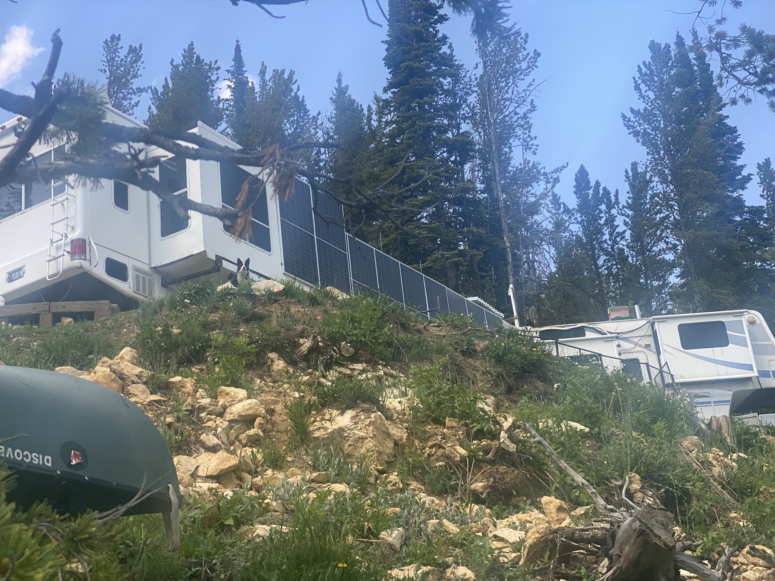 The original Las Vegas 5th wheel from 2006 — now gutted and converted into a snowmobile repair shop and solar panel collector at Elev8150, 8,150 feet in Anaconda Montana