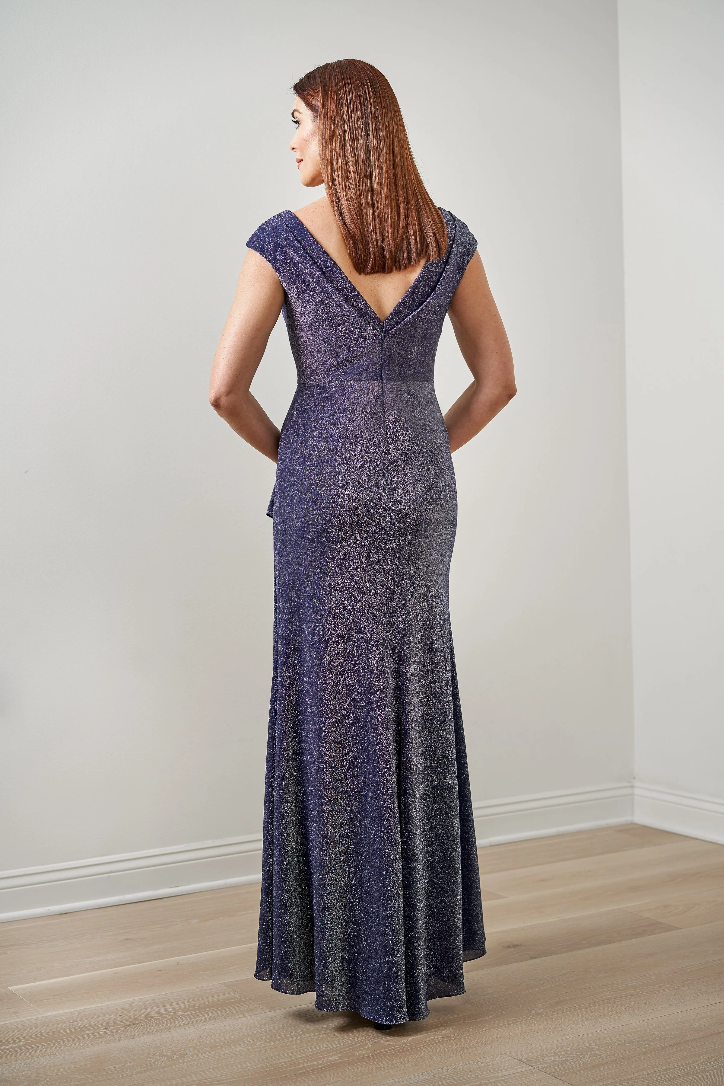 Back view of a shimmer purple mother of the bride gown with a graceful V-back neckline, cap sleeves, and sparkling metallic fabric for weddings and formal events.
