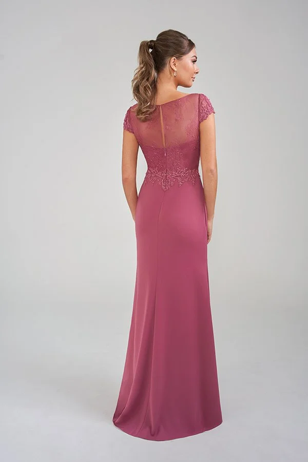 Back view of an elegant rose pink mother of the bride gown featuring a sheer illusion lace back, delicate cap sleeves, floral appliqué waist detailing, and a flattering floor-length silhouette for formal occasions.