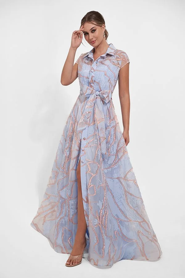 Front view of an elegant powder blue mother of the bride gown with blush embroidery, cap sleeves, a collared button-front bodice, waist tie belt, and flowing A-line skirt with a front split.