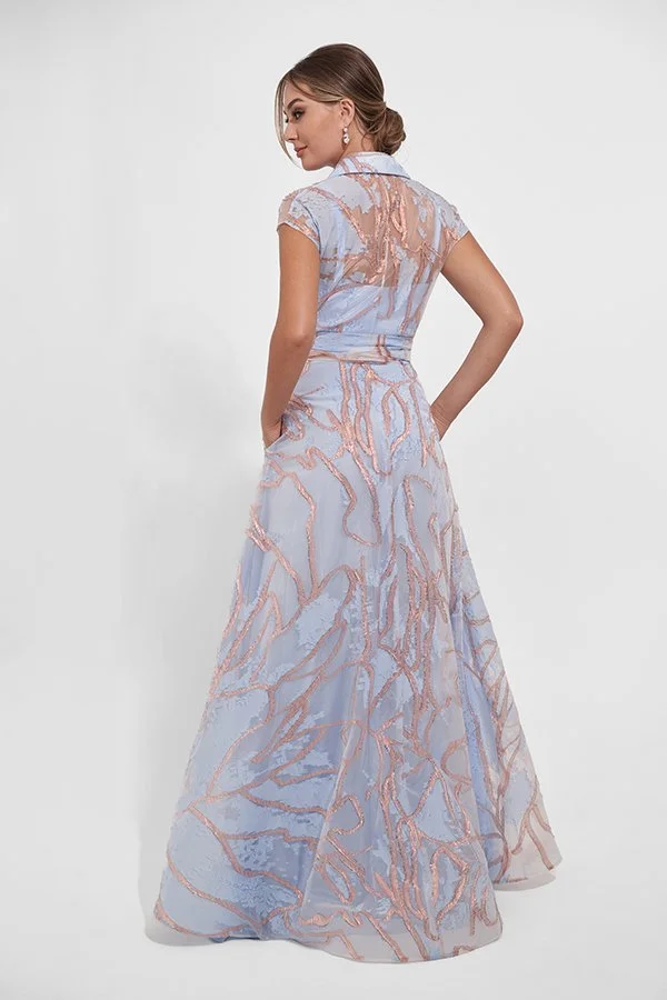 Back view of an elegant powder blue mother of the bride gown with blush embroidery, cap sleeves, a sheer collared back bodice, waist tie belt, and a flowing A-line silhouette for formal occasions.