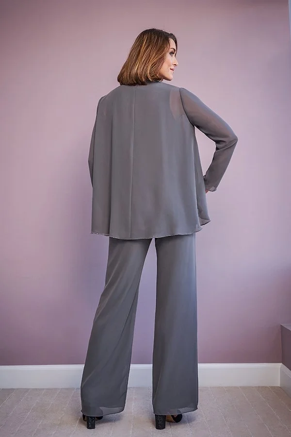 Back view of a charcoal mother of the bride trouser suit featuring wide-leg chiffon trousers, a flowing layered top, and elegant long sleeves for formal occasions.
