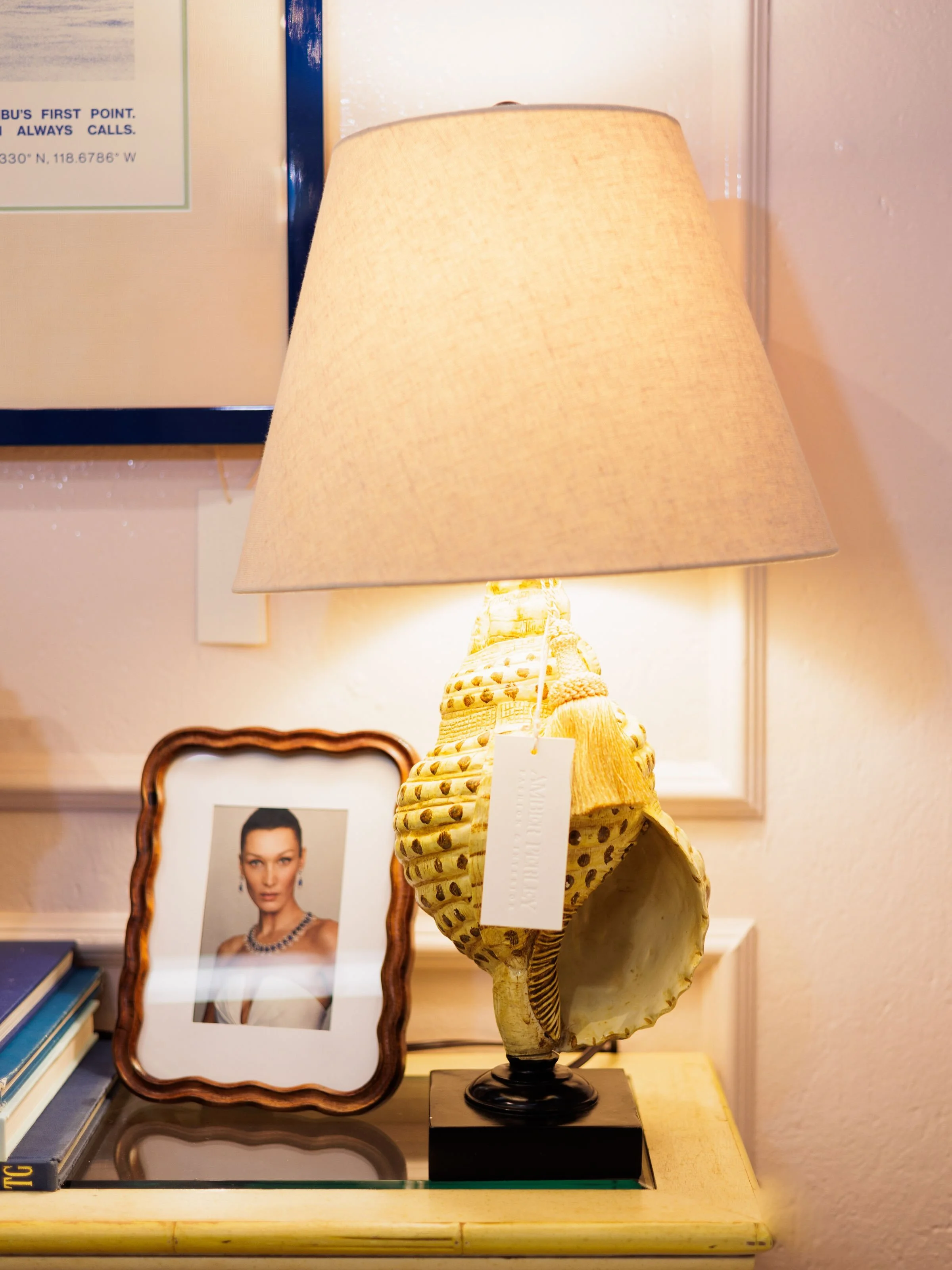 Sea Shells! In all forms! 
Love these lamps. Casual, coastal, and natural 🐚 

🏷️ Pair of Coastal Faux Shell Table Lamps with Linen Shades 

A striking pair of coastal table lamps featuring detailed faux conch shell bases mounted on solid black plin