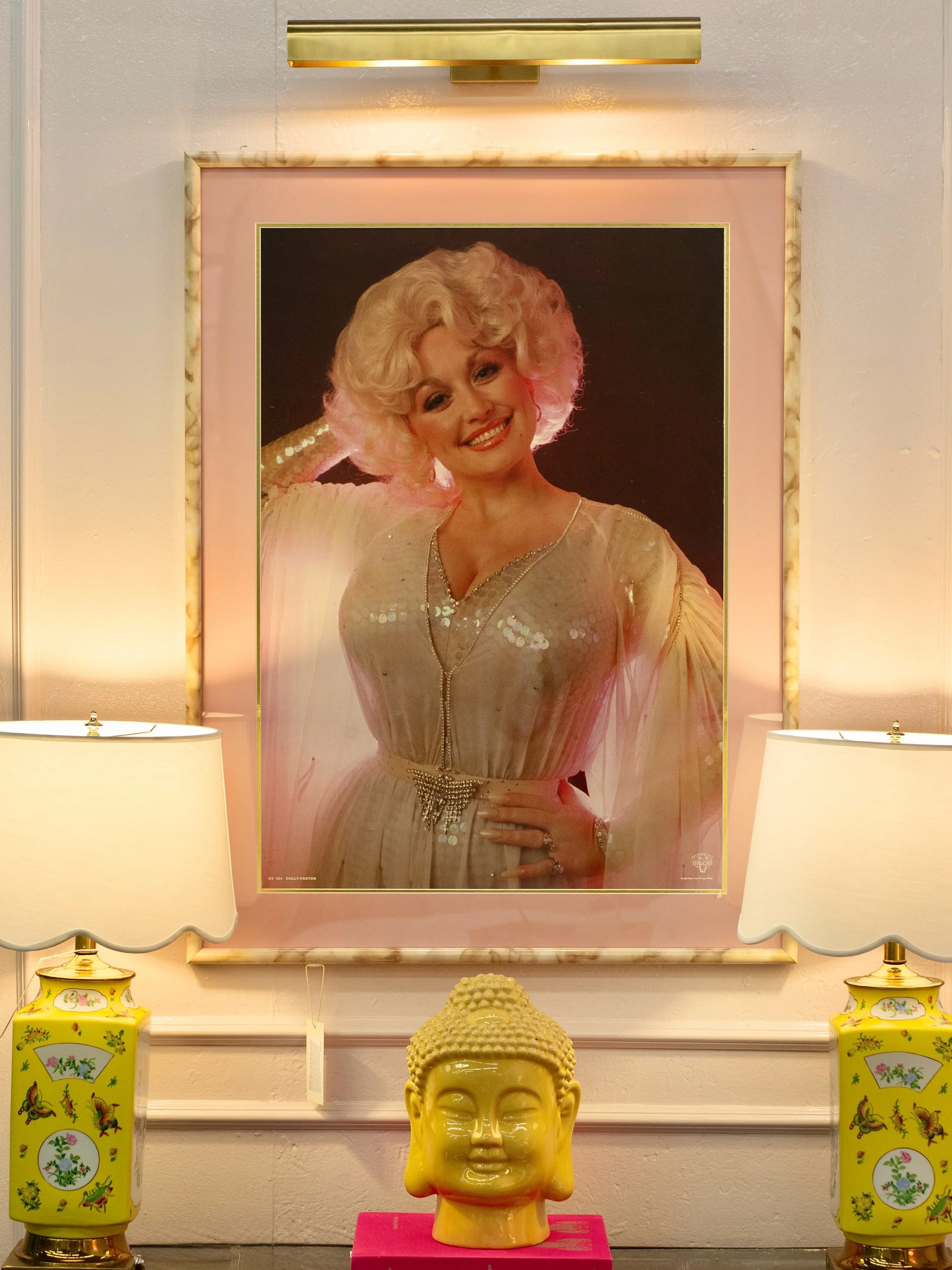 DOLLY 🦋🪩✨

This custom designed and framed vintage poster of Dolly Parton is a one-of-a-kind!  Shortly after her passing, I saw this poster and knew I had to honor her legacy. Framing could have gone in many directions, but I wanted to keep it clas