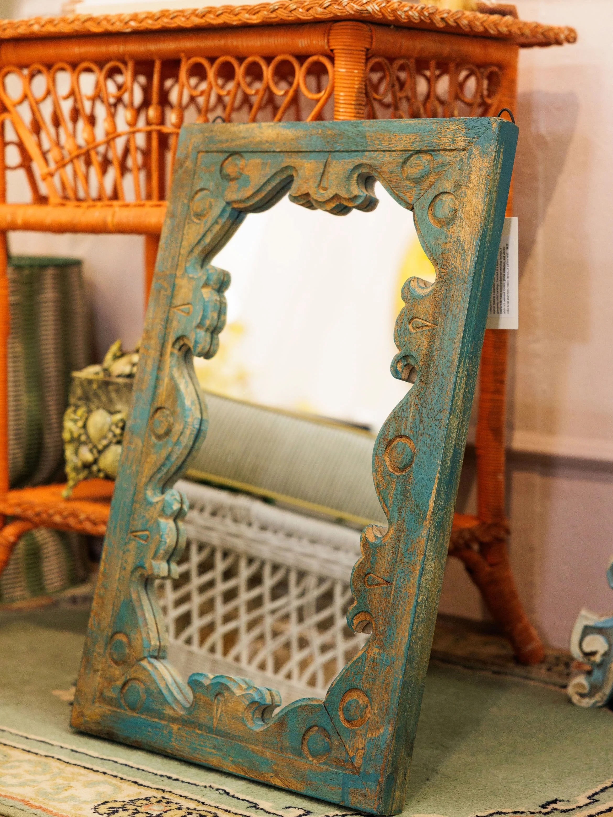 I love this mirror! - Measuring at 16x20&rdquo;, it can fit into any entry way, vanity space, living room, hallway, or closet. It&rsquo;s hand-carved and hand-painted making it a unique and worldly addition to your space. 
And it&rsquo;s only $75! Re