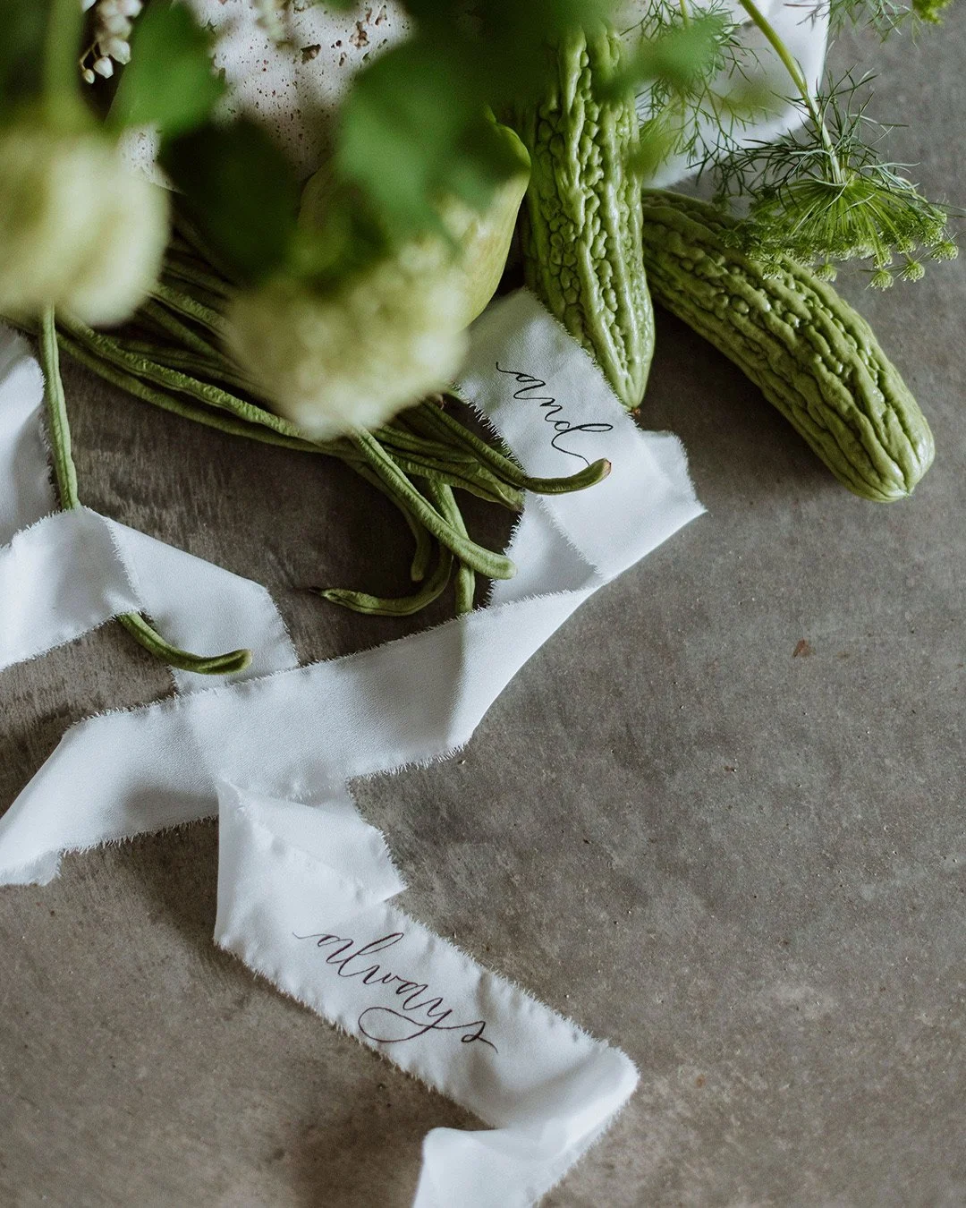 brush-lettering-silk-ribbon-wedding-floral-arrangement.jpg