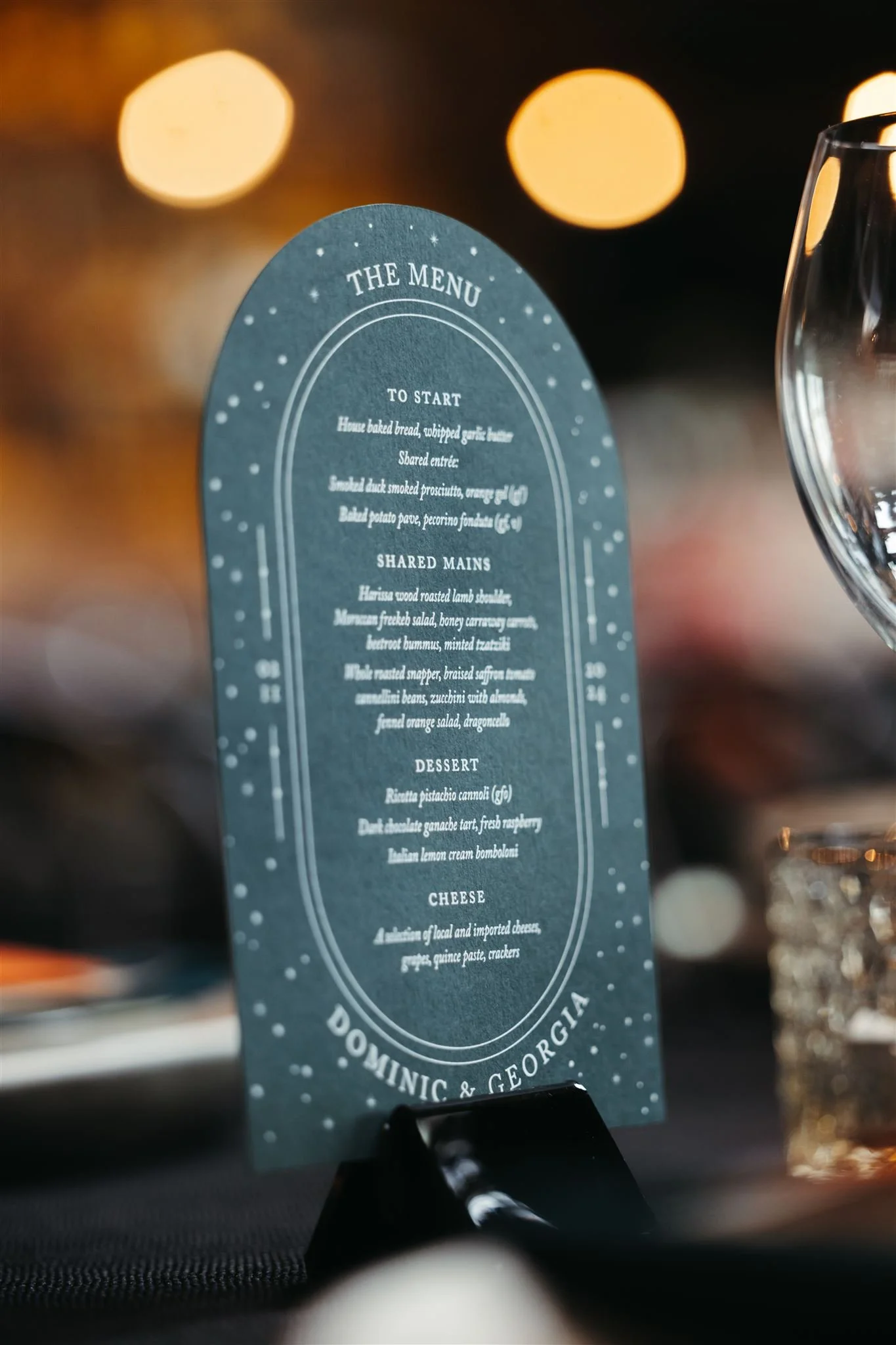 dark-green-emerald-celestial-arch-wedding-menu.jpg