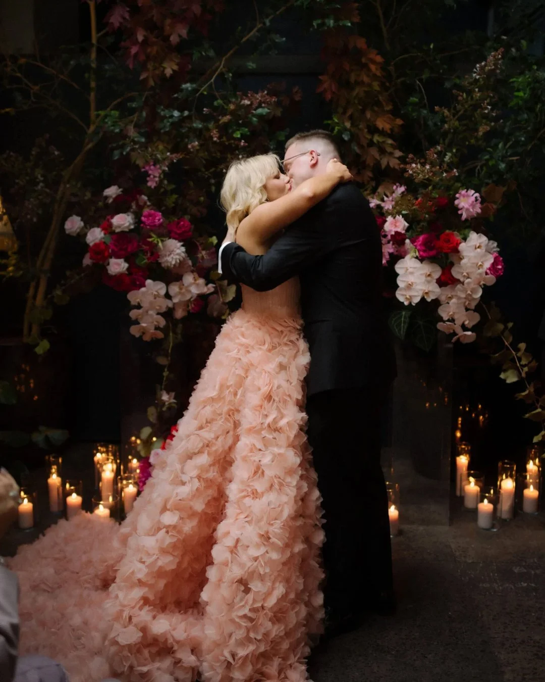 dark-moody-wedding-reception-pink-red-florals.jpg
