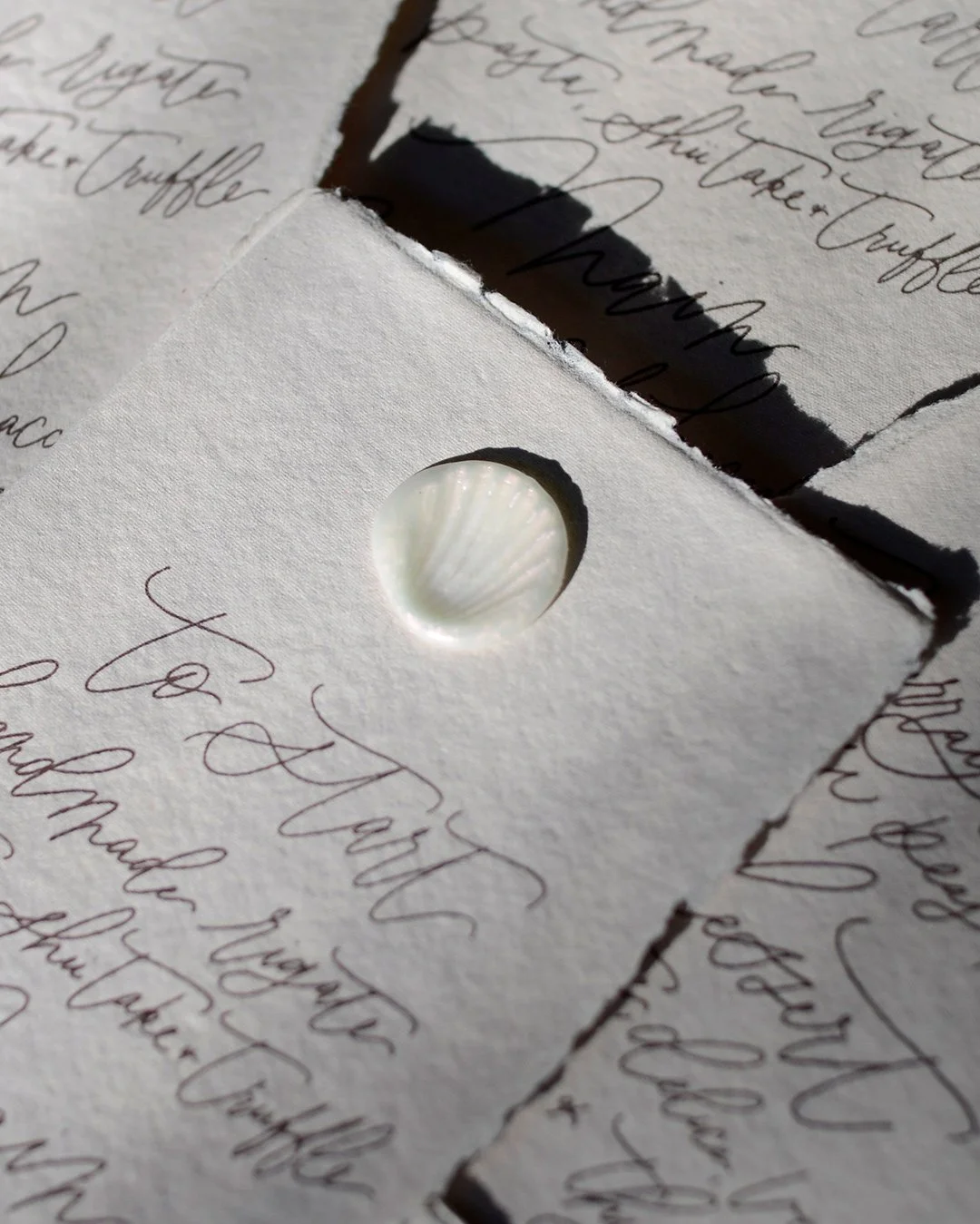 deckled-edges-handmade-paper-luxury-menu-hand-lettering-seashell-wax-seal.jpg