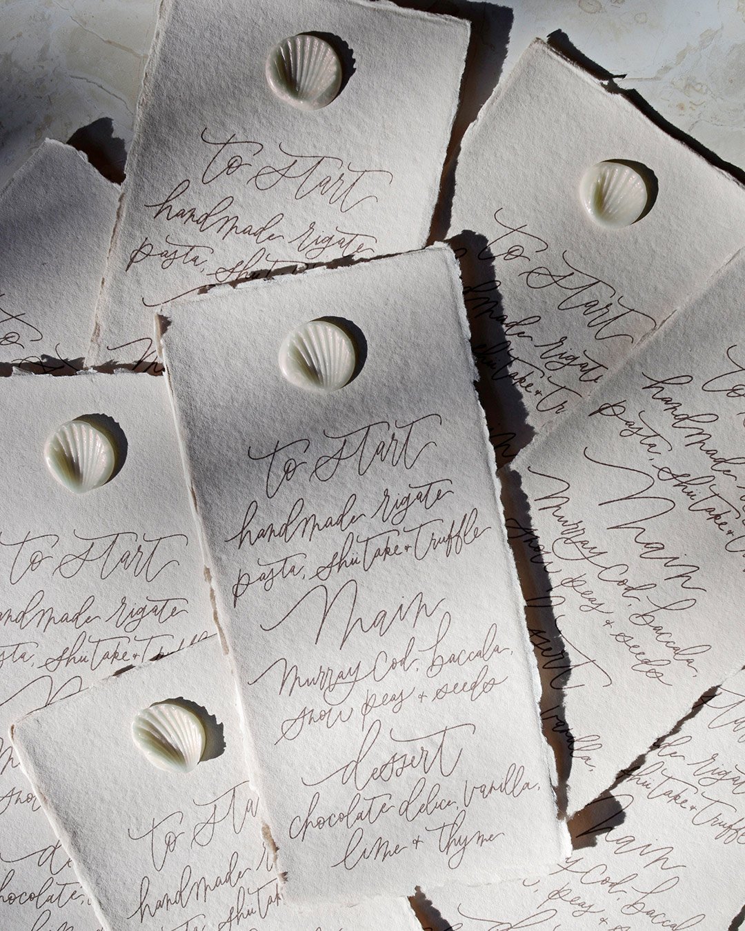handmade-paper-luxury-menu-modern-calligraphy-seashell-wax-seal.jpg