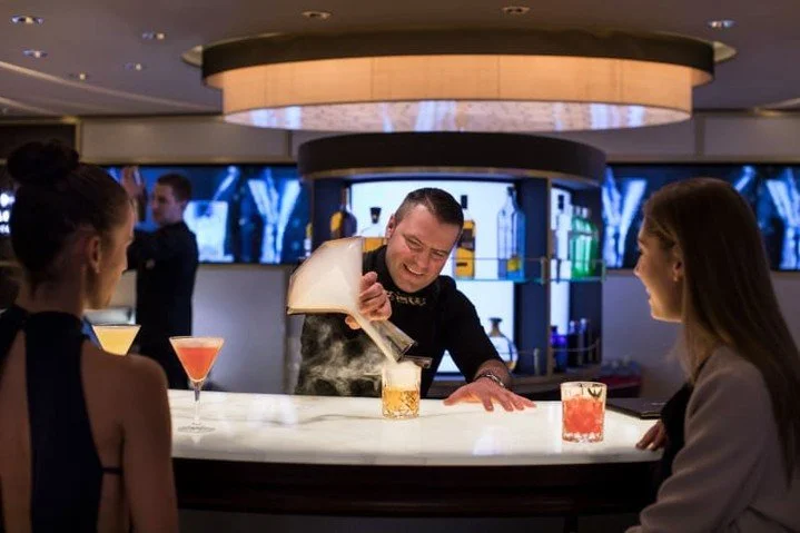 🍸✨ Experience the art of mixology at the World Class Bar aboard the Celebrity Reflection! Indulge in expertly crafted drinks, like the smoky Zacapa in the Clouds, while enjoying exceptional service in a sophisticated atmosphere. This bar promises to