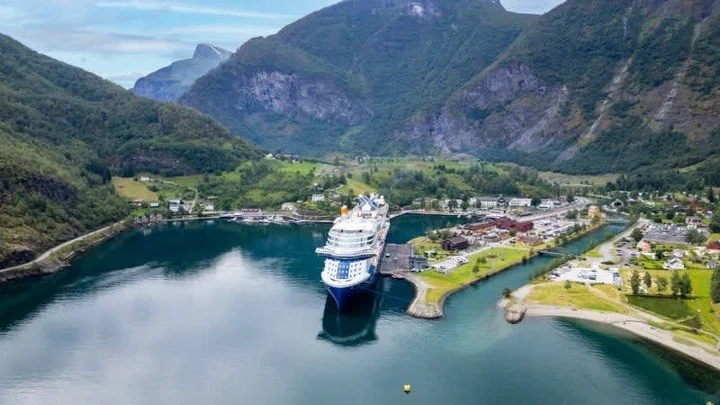 🌄🚢 Discover the breathtaking beauty of the Norwegian Fjords with Celebrity Apex! Experience the stunning landscapes of Flam, where majestic mountains meet serene waters, creating a picturesque backdrop for your adventure. From charming towns to dra