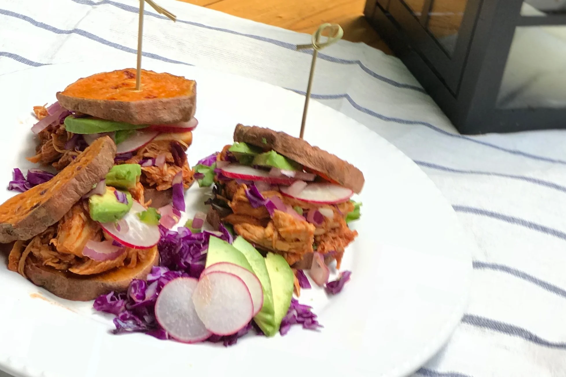 Buffalo Sliders featuring The New Primal’s medium buffalo sauce! Great flavor, good heat. It pairs great with the sweet potato sliders and crunchy red cabbage and radishes. Cool it off with a little avocado and a squeeze of lime!