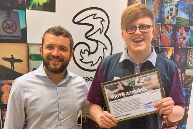 Scott Allison, Area 1 Manager for Three, presents Connor Allan with the ‘Advisor of the Month’ Award