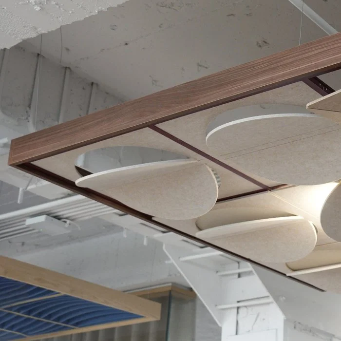 A close up on a walnut Leon x Askia Acoustic Island featuring Oatmeal Luna Tiles