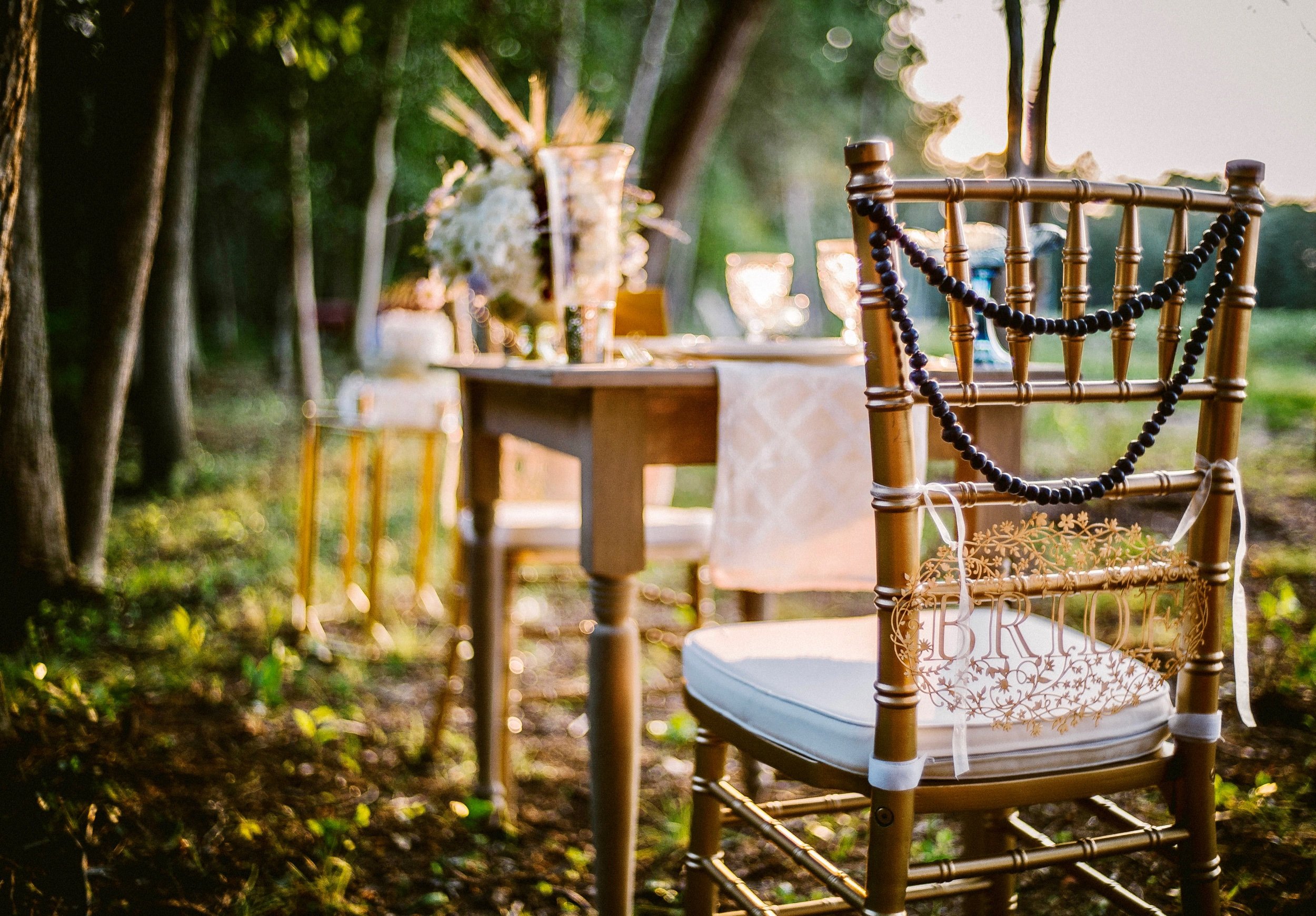 Farm wedding dinner table in forest.jpeg