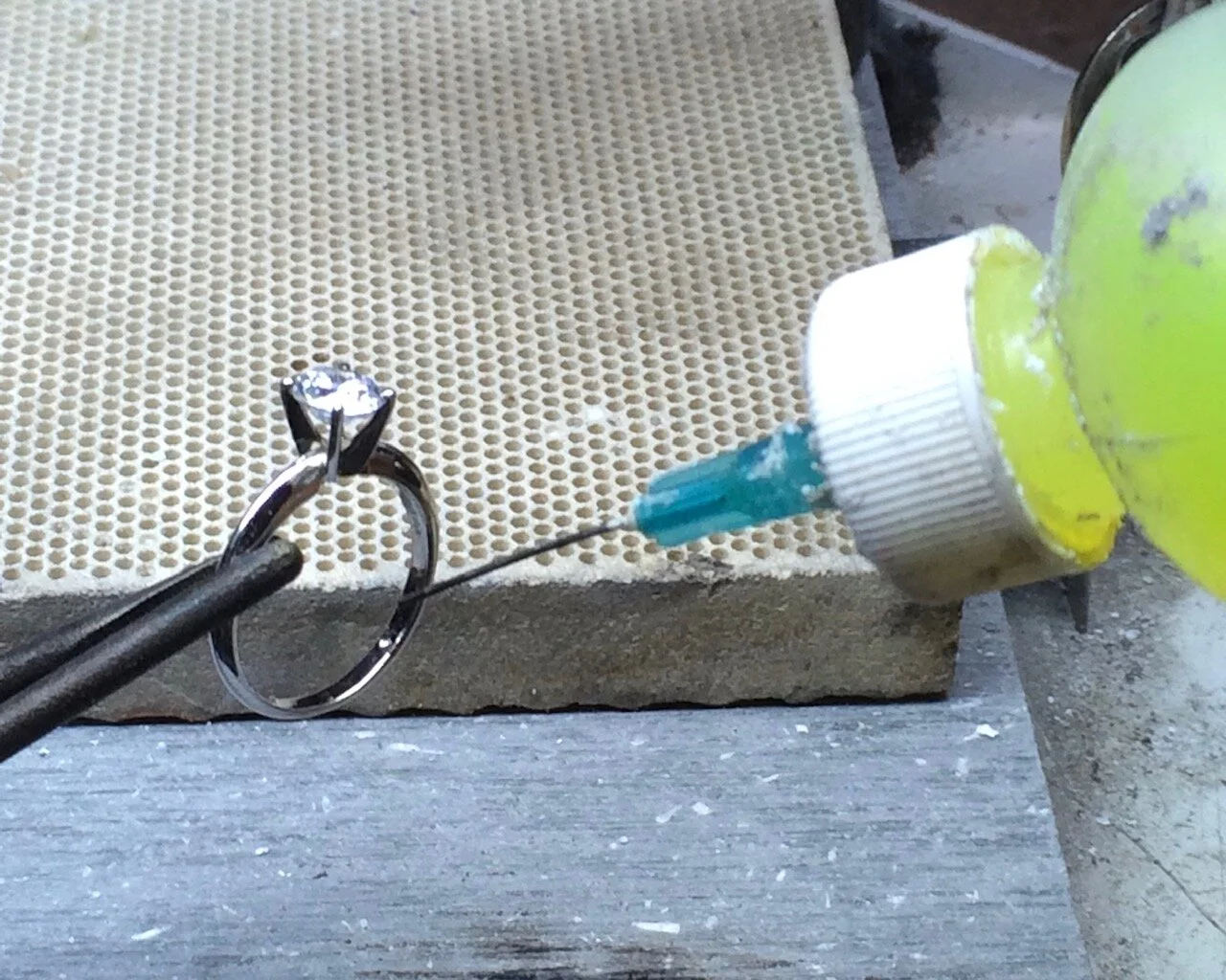 We add some flux so that the solder will flow into place.