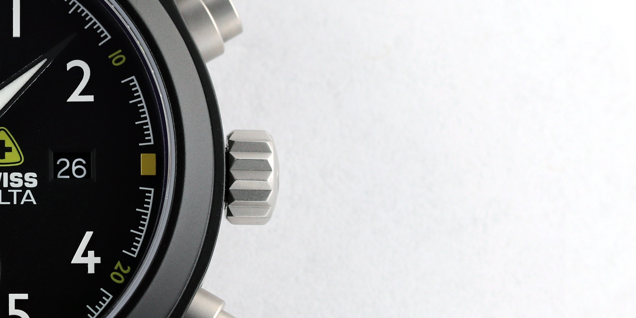 Detail of a chronograph watch's dial and case.