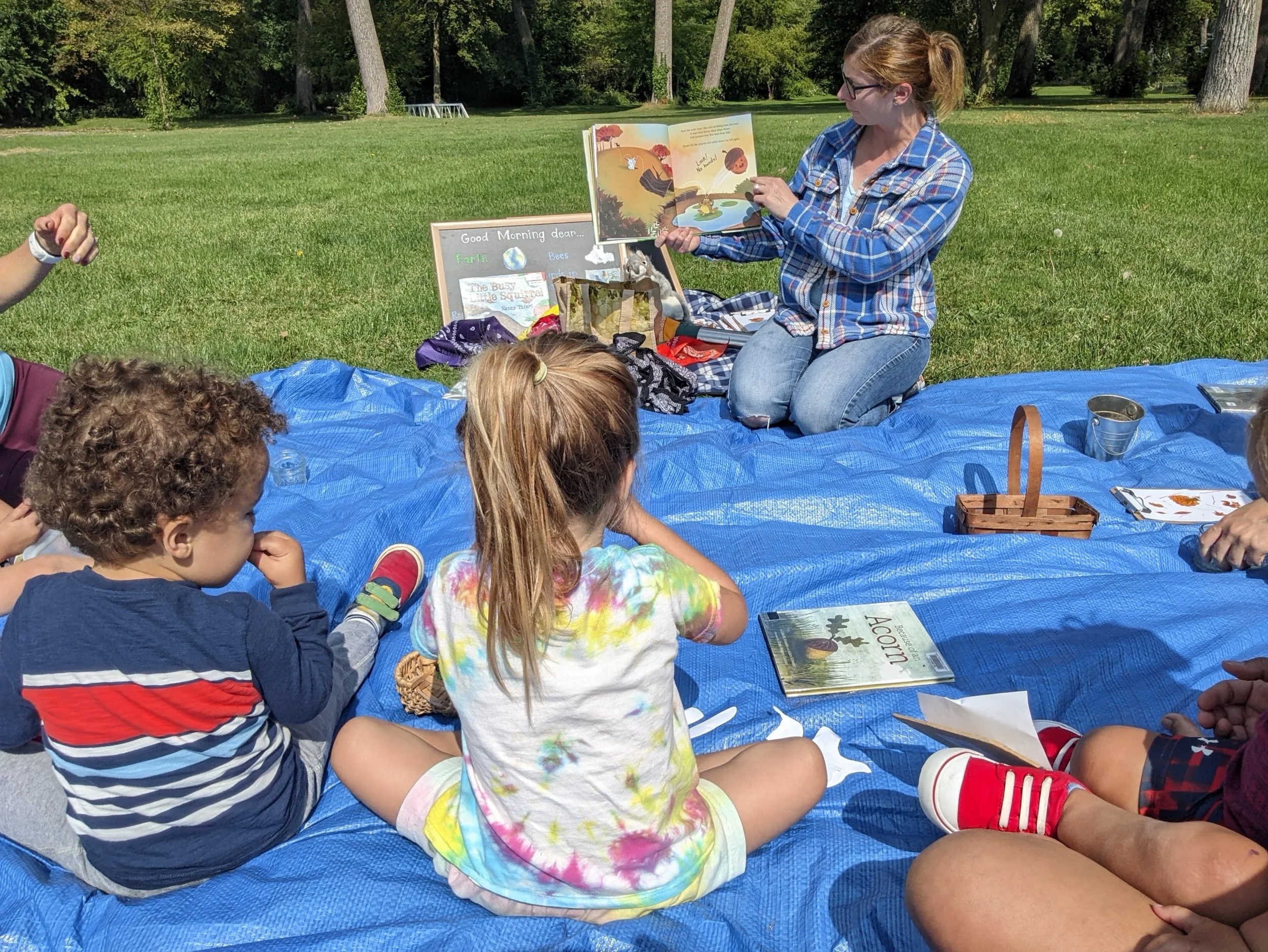 What to expect at a Naturing class part 2: Following arrival and gathering activities, we circle up for STORYTIME. Caregivers bring out their snacks and we come together for some songs and stories related to the theme of the day before we head out in