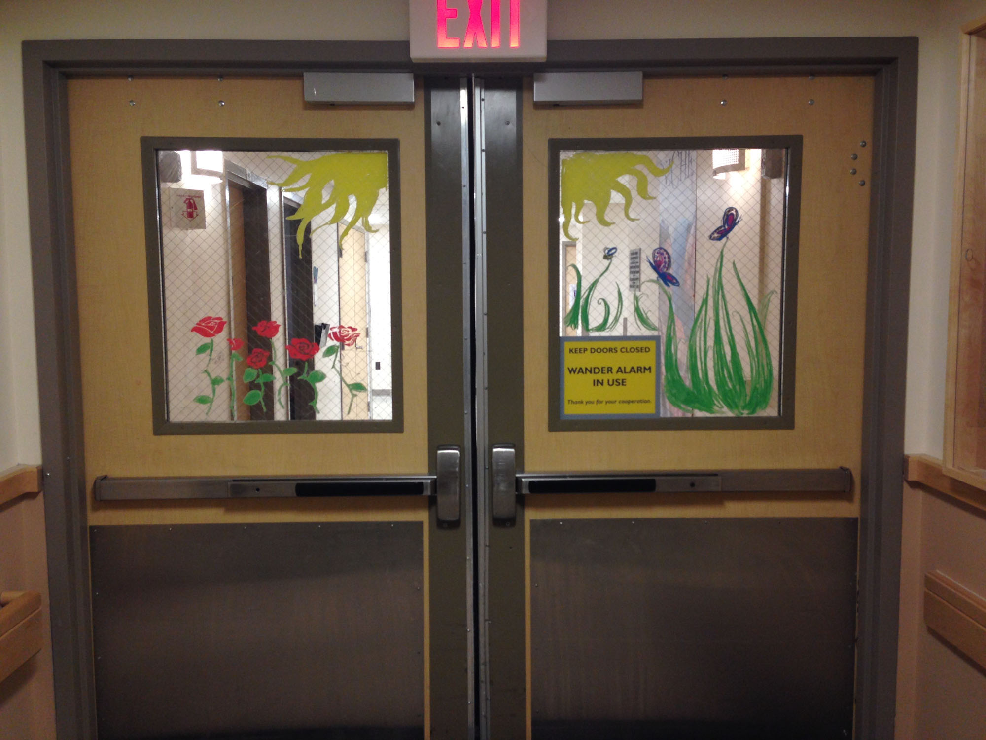  Window drawings by volunteers to help greet people at the entrance to a hospital unit. 