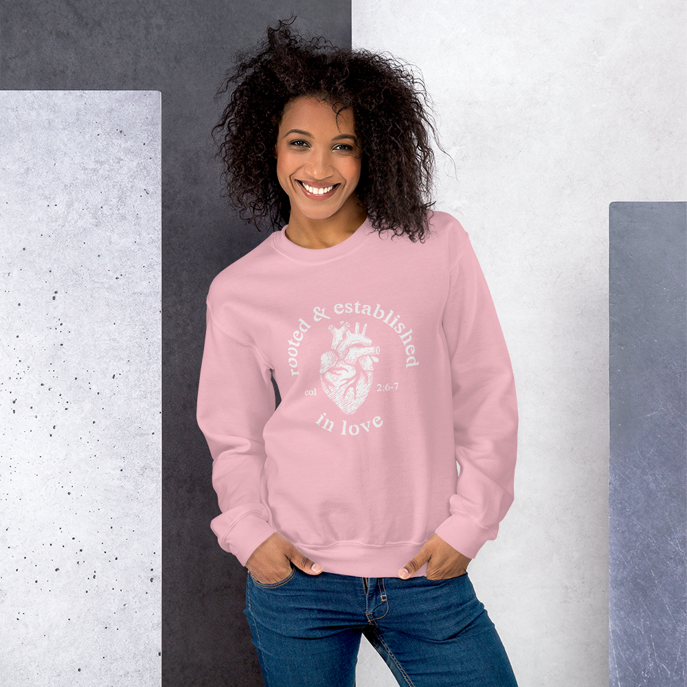 Rooted-Final-Front-W_YX-Logo-W_printfile_front_Rooted-Final-Front-W_YX-Logo_mockup_Front_Womens-Lifestyle-2_Light-Pink.png