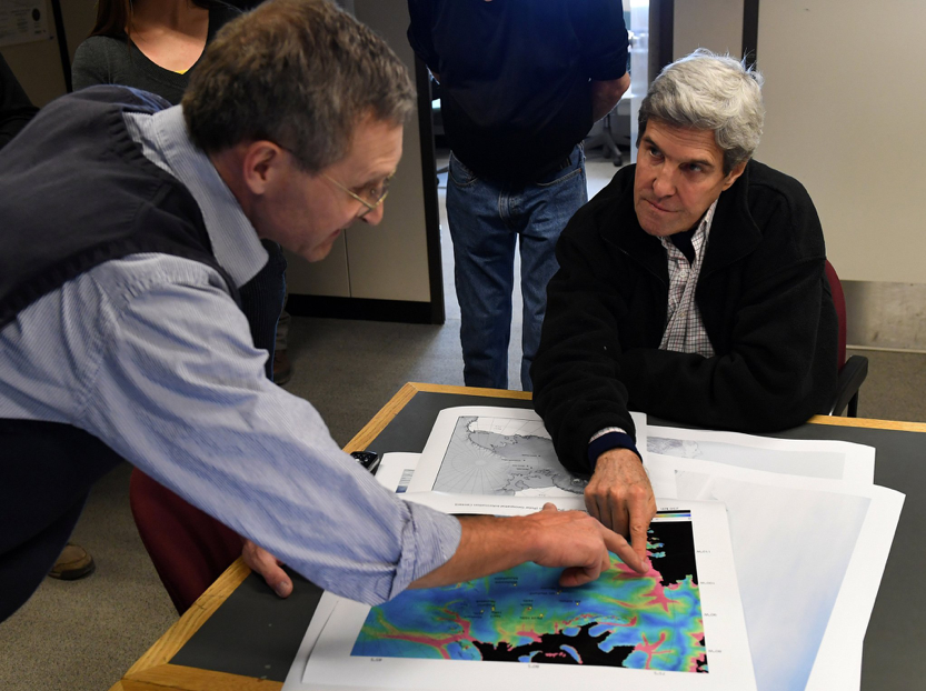 Then-U.S. Secretary of State John Kerry, right, listens to geologist John Stone at the Crary Science and Engineering Center in Antarctica. Image credit: Mark Ralston via AP