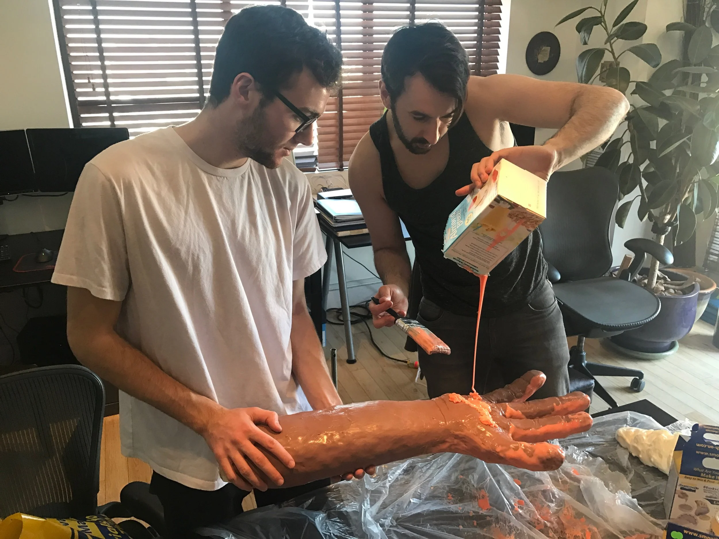  Director Daniel White and Line Producer Victor Alvarez cast the skin of the Monster Arm. 