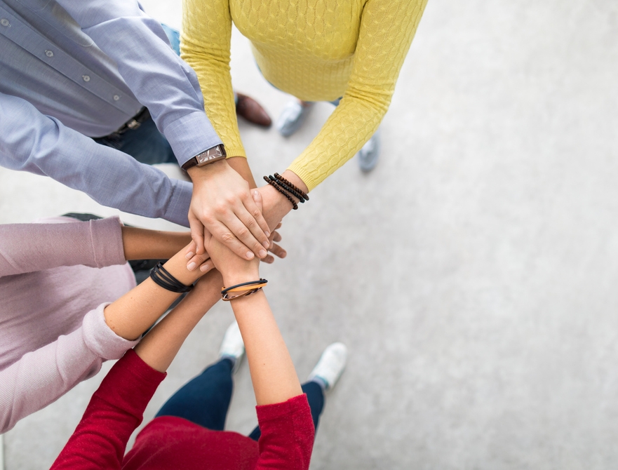 Stack-of-hands.-Unity-and-teamwork-concept.-882292568_1569x672.jpeg