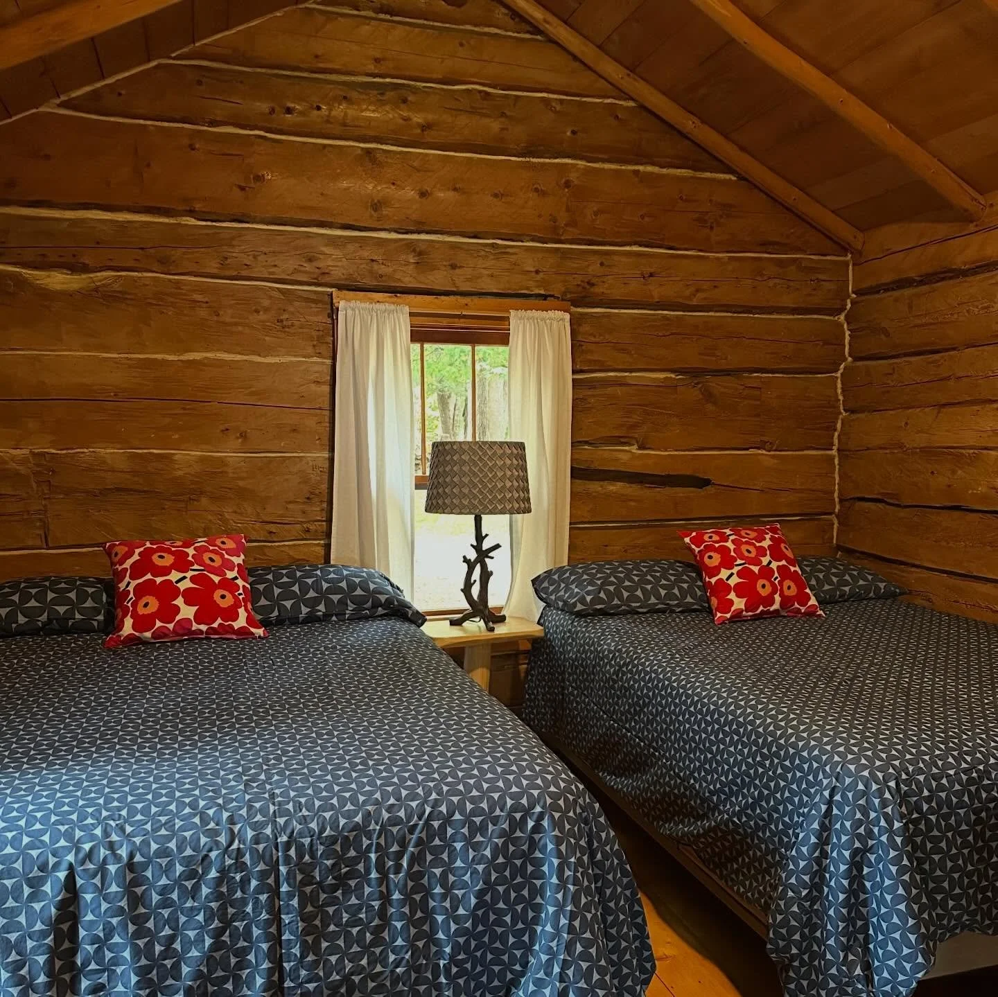 Always a comfy bed to come home to. manninenscabins.com #otterlakelife #manninenscabins