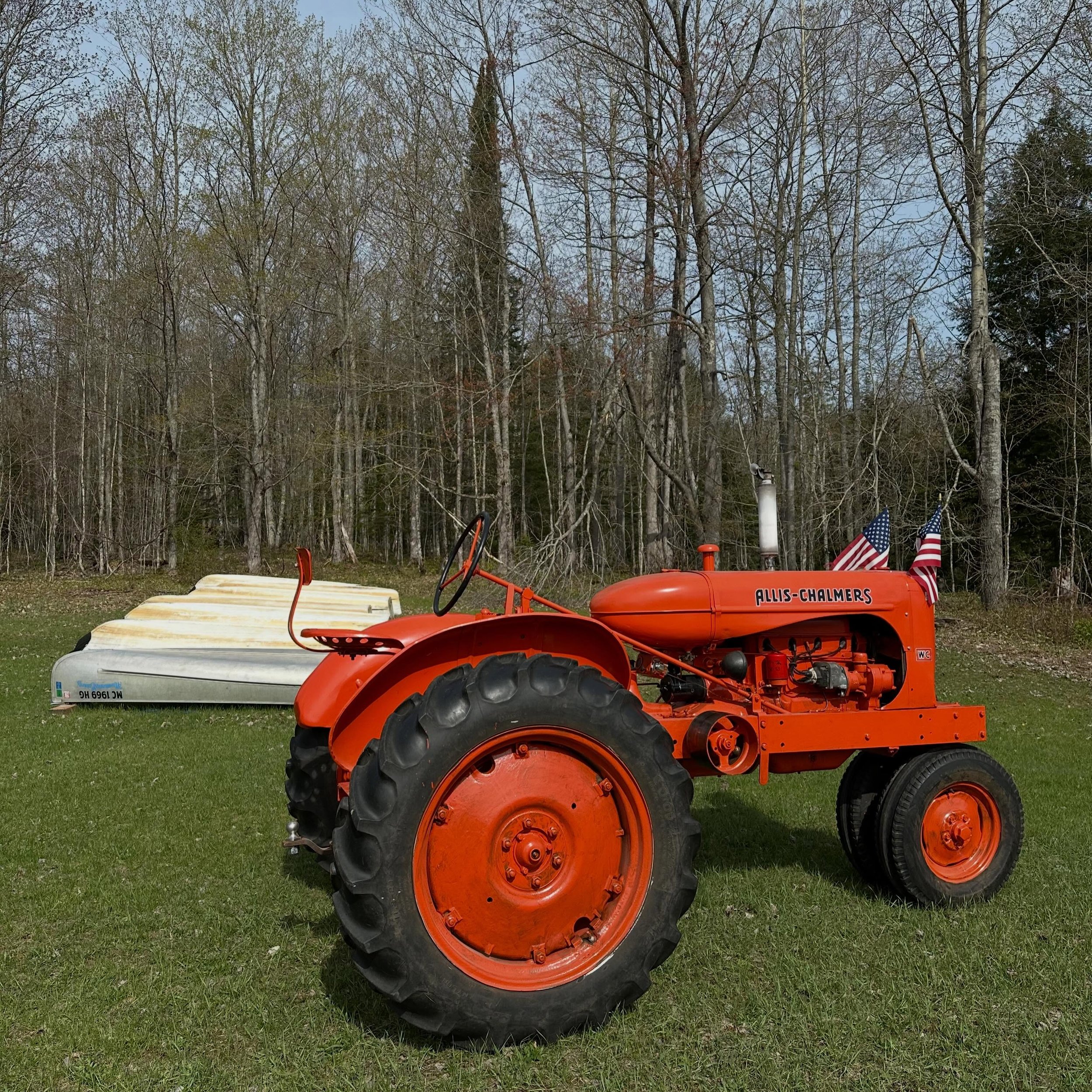Docks and boats are in with the help of this beautiful tractor 😍 manninenscabins.com #otterlakelife #manninenscabins