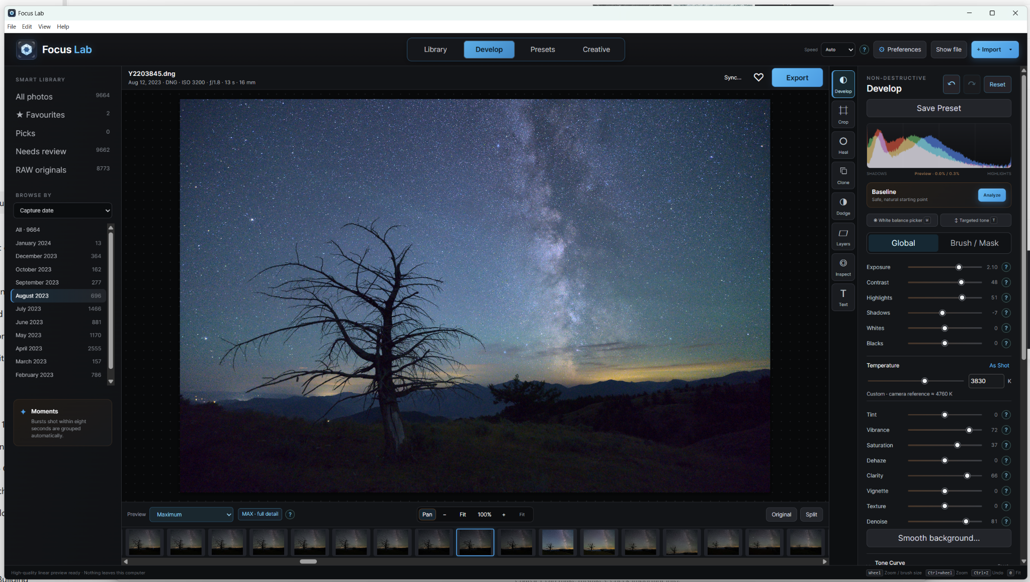 Focus Lab Develop workspace showing a tree under the Milky Way, local library, filmstrip, histogram and editing controls.
