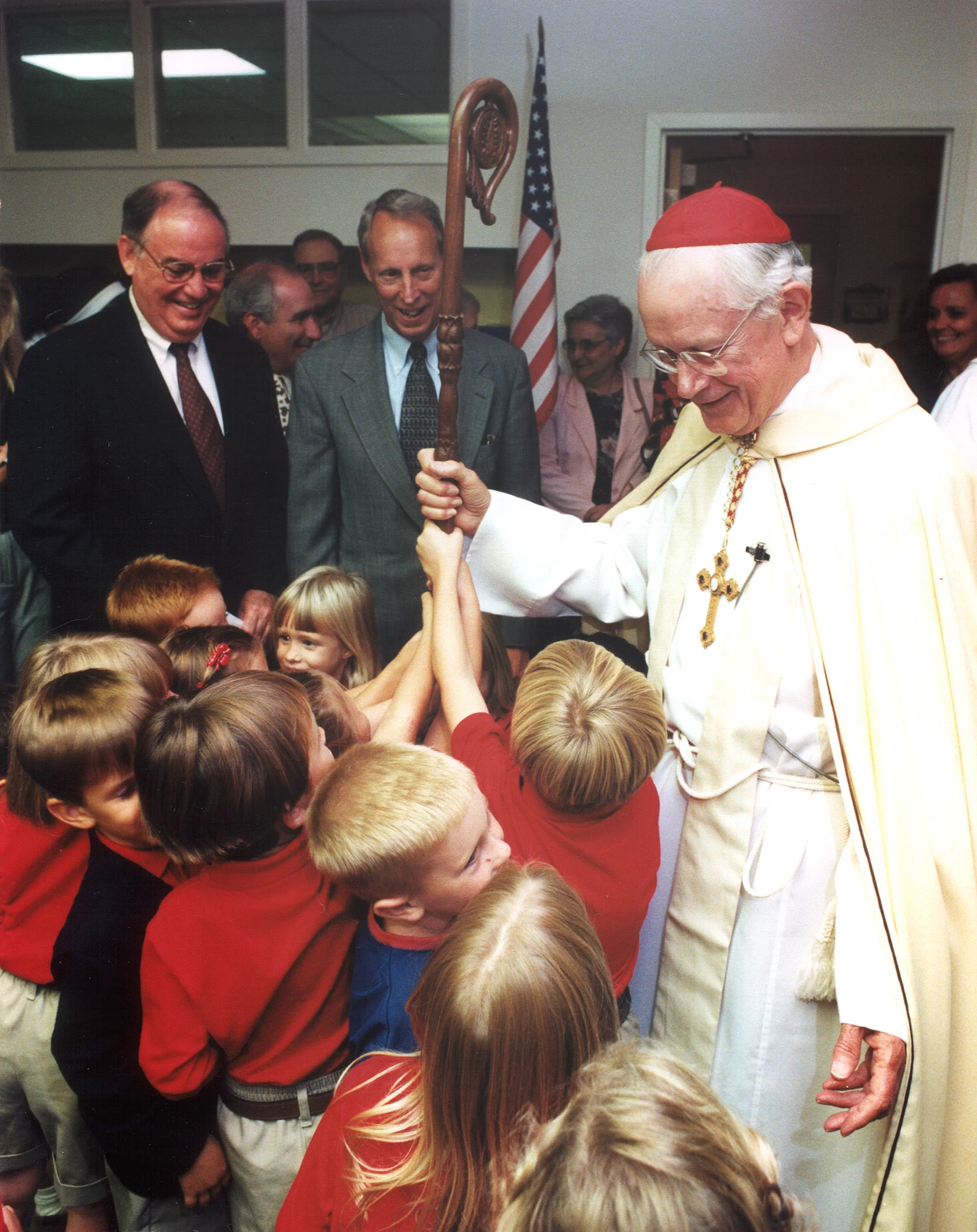 Cardinal James Hickey dedicates the school in 1997.