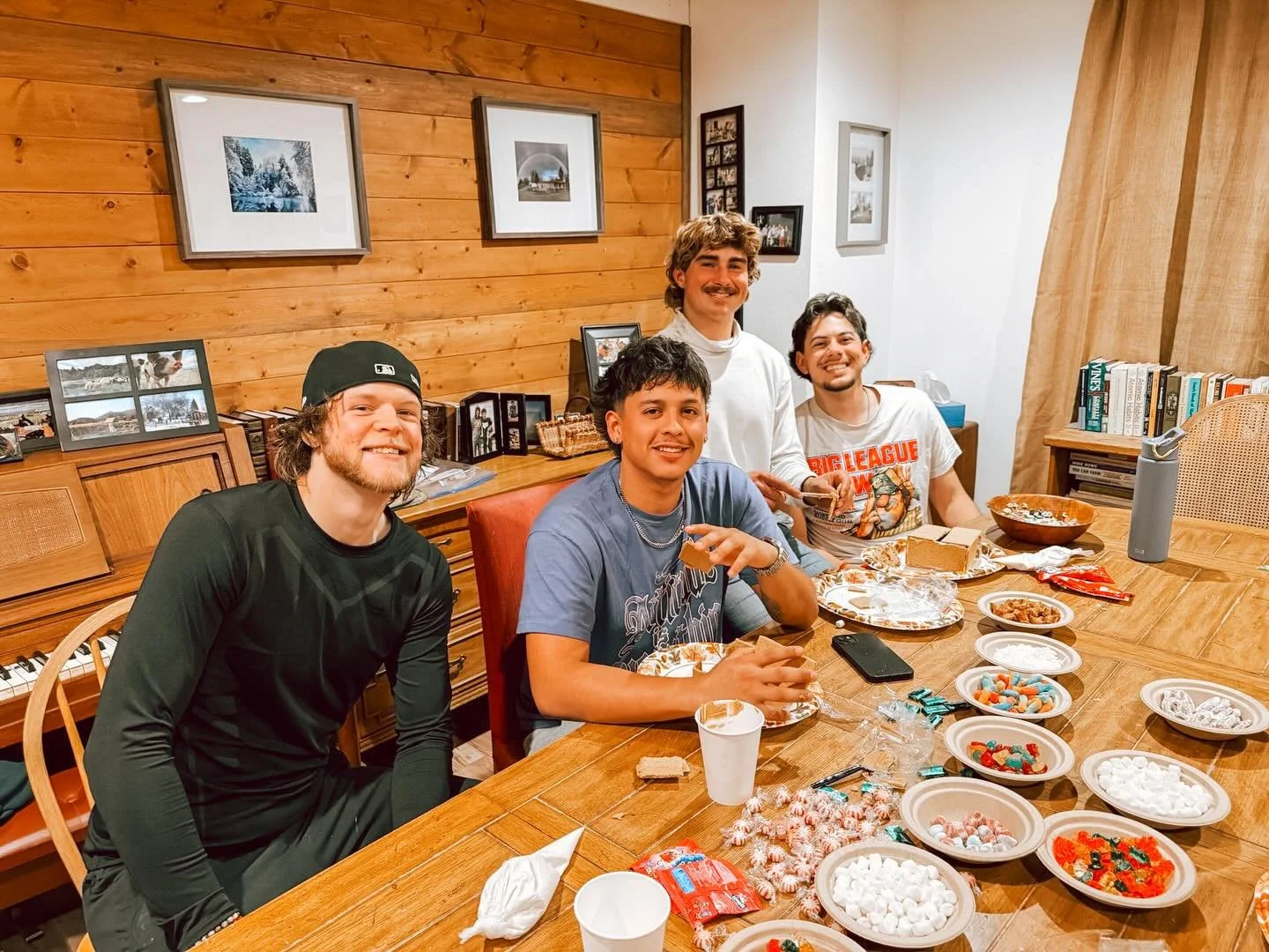 Our annual gingerbread house competition = marshmallows, frosting, peppermints, gumdrops, and graham crackers everywhere! 🏠🍬 From a nativity scene to the workout shed, the barn, a Mayan temple, a Spanish church, and even a fairytale cabin in the wo