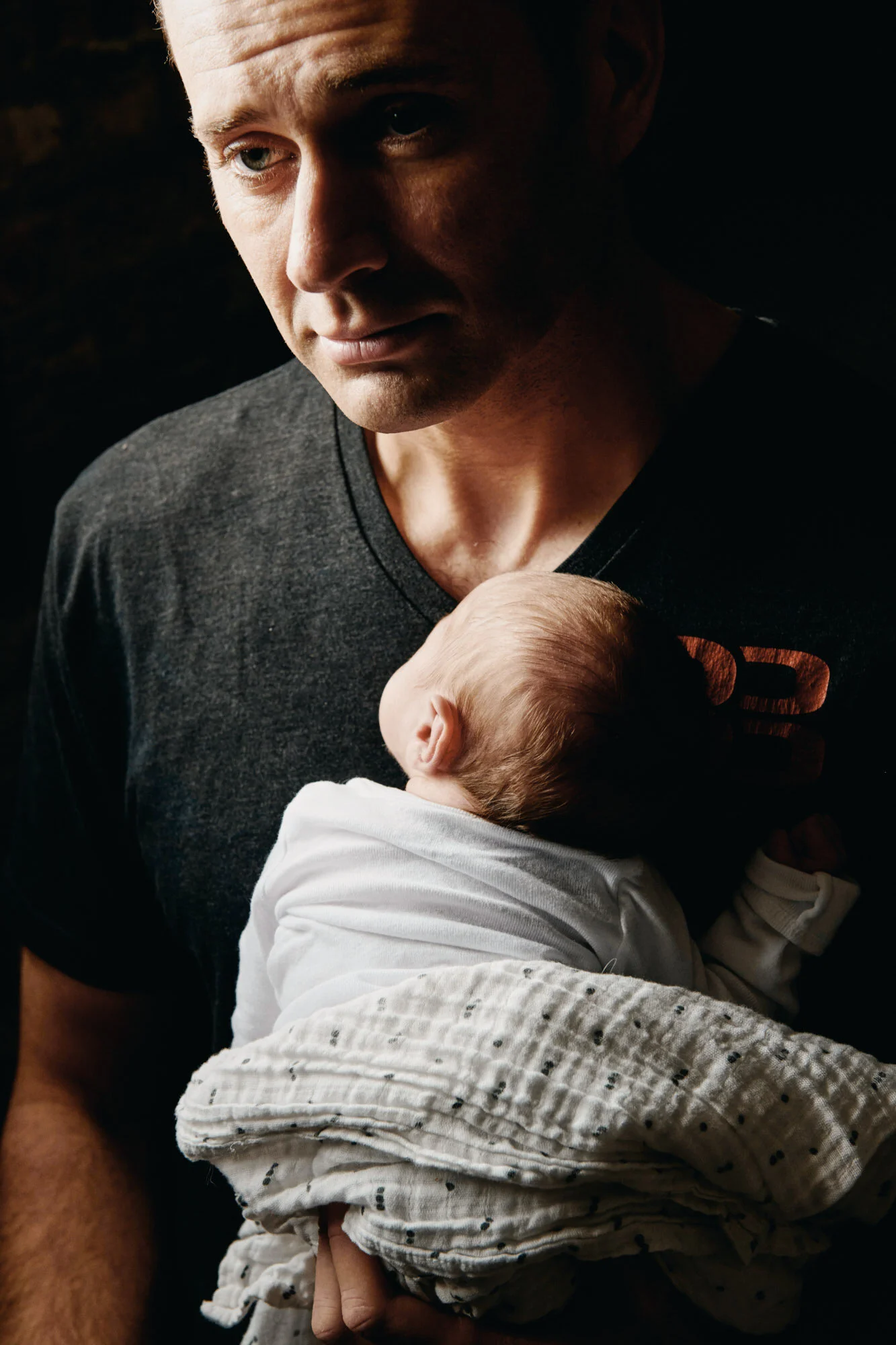 photography studio, professional female portrait, Sydney best portrait photographer, editorial style portraits, Leah Lefens Photography, Professional sydney photographer, Redfern Photographer, new dad holding baby with a calm worried face