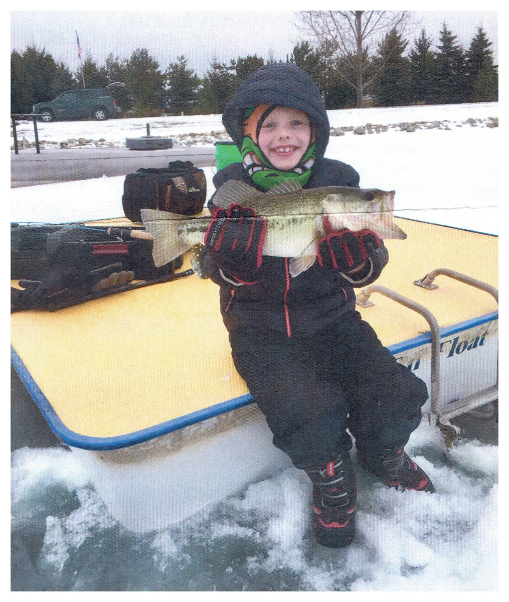 Youth Winner: Carter Kuenstler; Valders, WI - 22” Largemouth Bass on a pond using a Jigging Rap