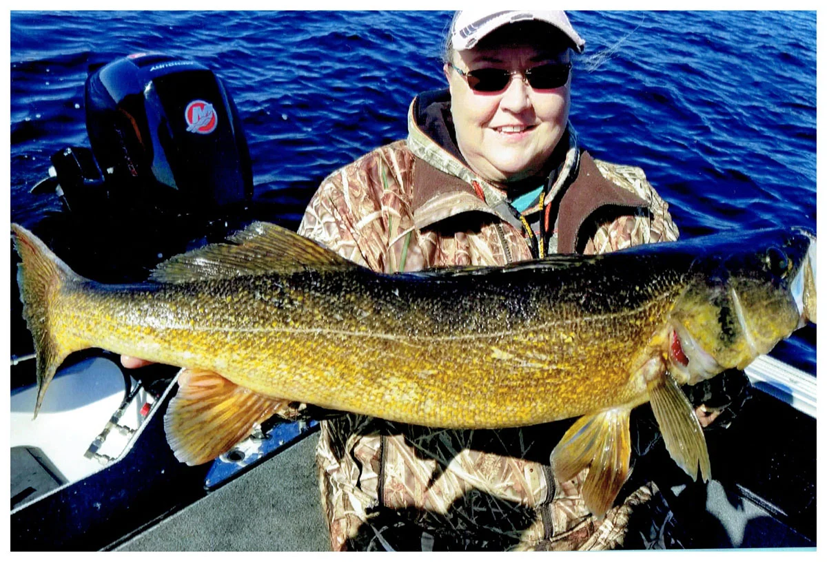 Sonja Nikosch; Burnsville, MN - 31” Walleye on the Bay of Green Bay using a Rapala