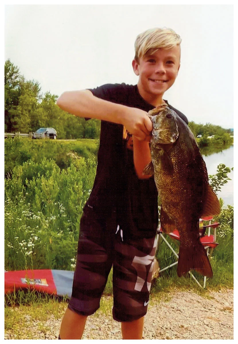 Youth Winner: Carter Boynton; Eyota, MN - 22” Small Mouth Bass on Mississippi backwaters using a wacky worm