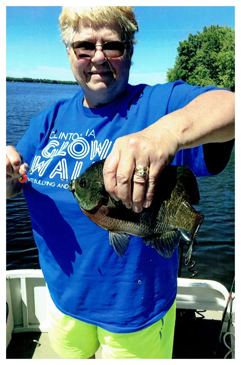 Kathy Springer; Clinton, IA - 12” Bluegill on Clam Lake using a worm