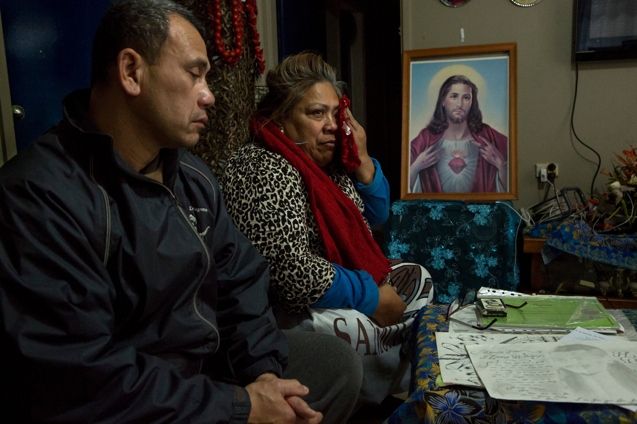 Mr. Togatuki and his wife, Atagai, with some of the items returned to them from their son’s prison cell after his suicide. Credit: David Maurice Smith for The New York Times