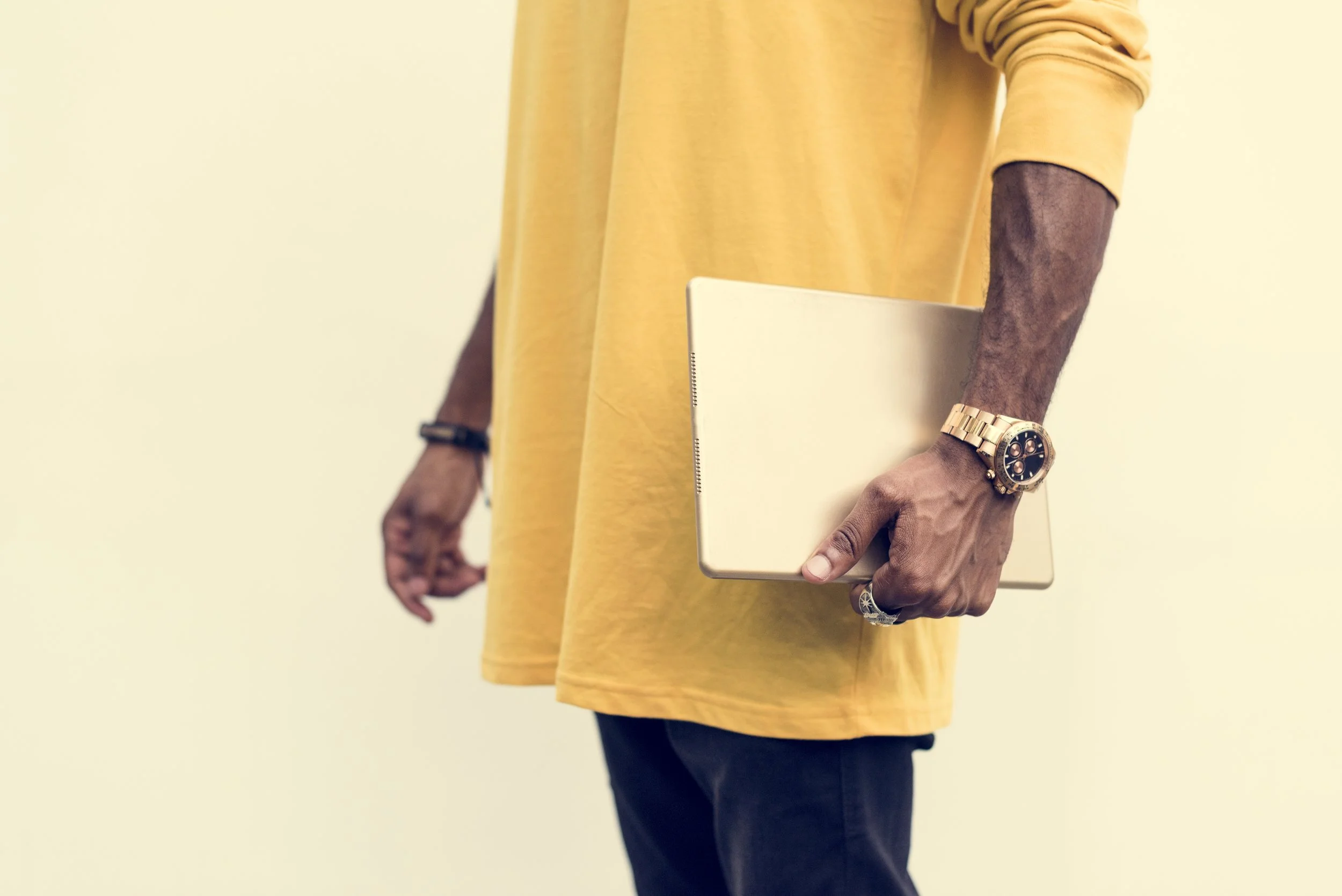 african-man-holding-a-laptop-PRKQBJ8.jpg