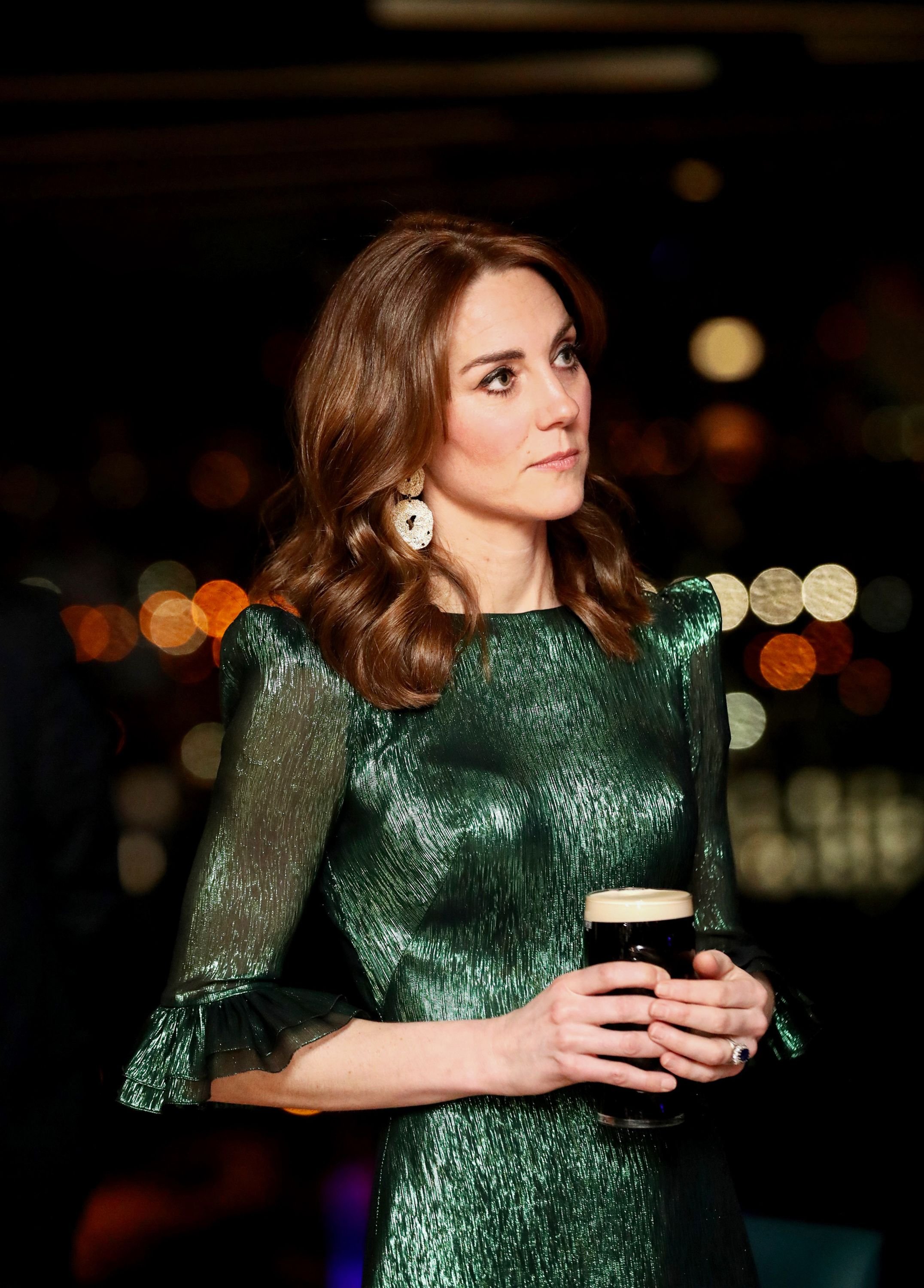 catherine-duchess-of-cambridge-holds-a-pint-of-guinness-as-news-photo-1583341038.jpg