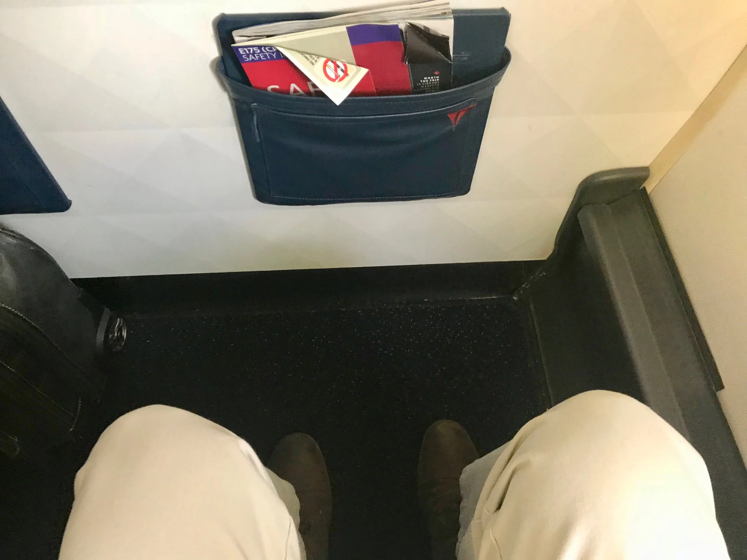 There is more knee space in 1D than other rows in the First Class cabin. However, there is no under seat stowage and you cannot stretch your legs as far as in other rows.