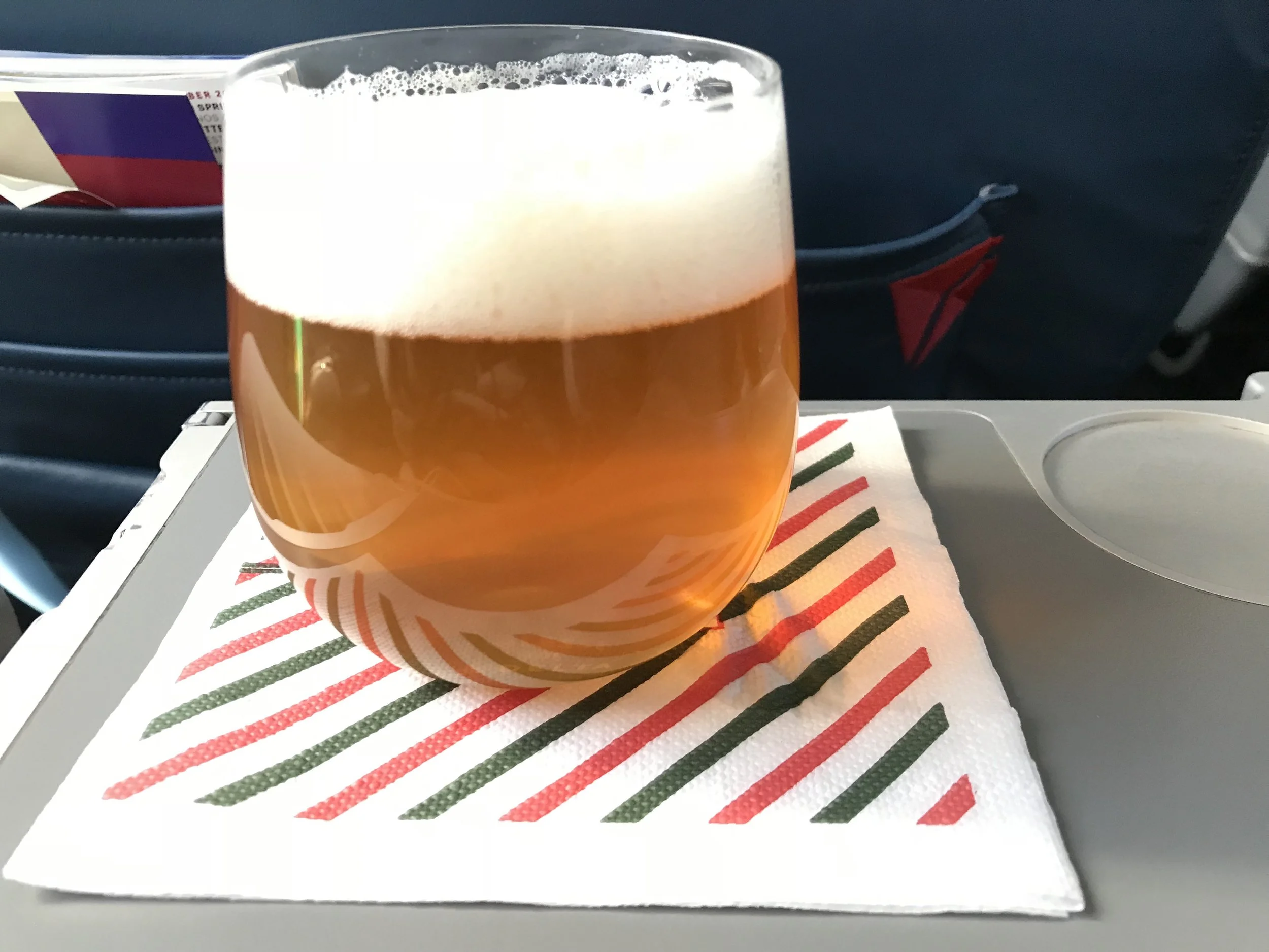 The tray table folds out of the right arm rest.