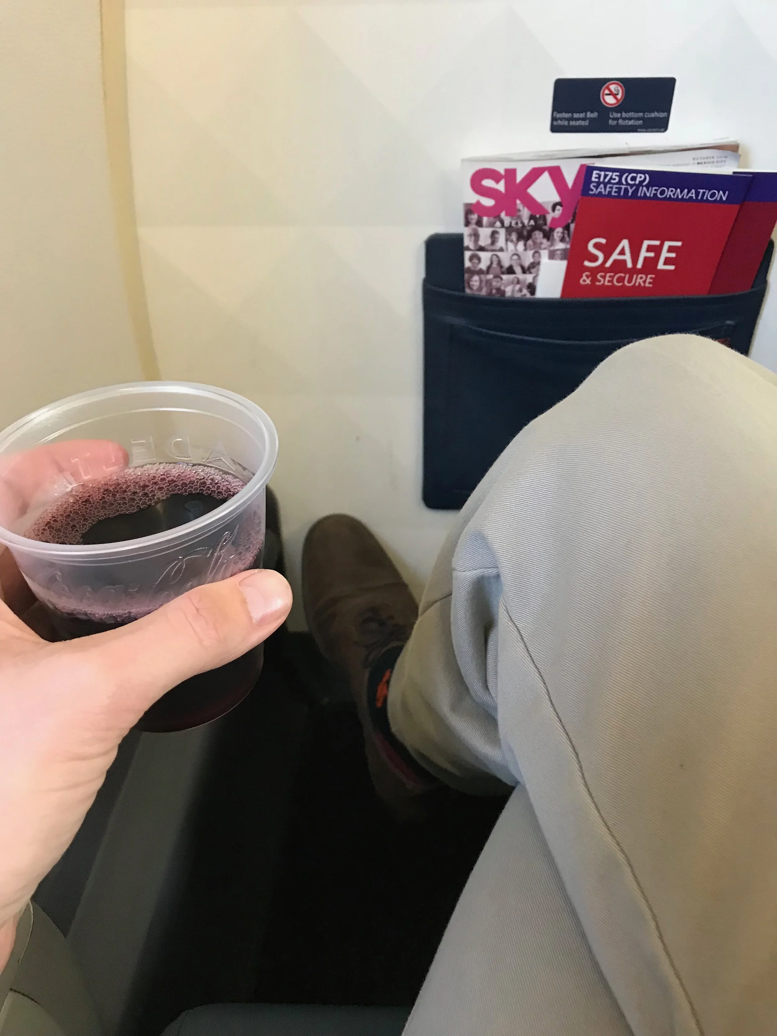 There is more knee space than the other rows, but there is not as much room to stretch your legs. There is also no under seat stowage.