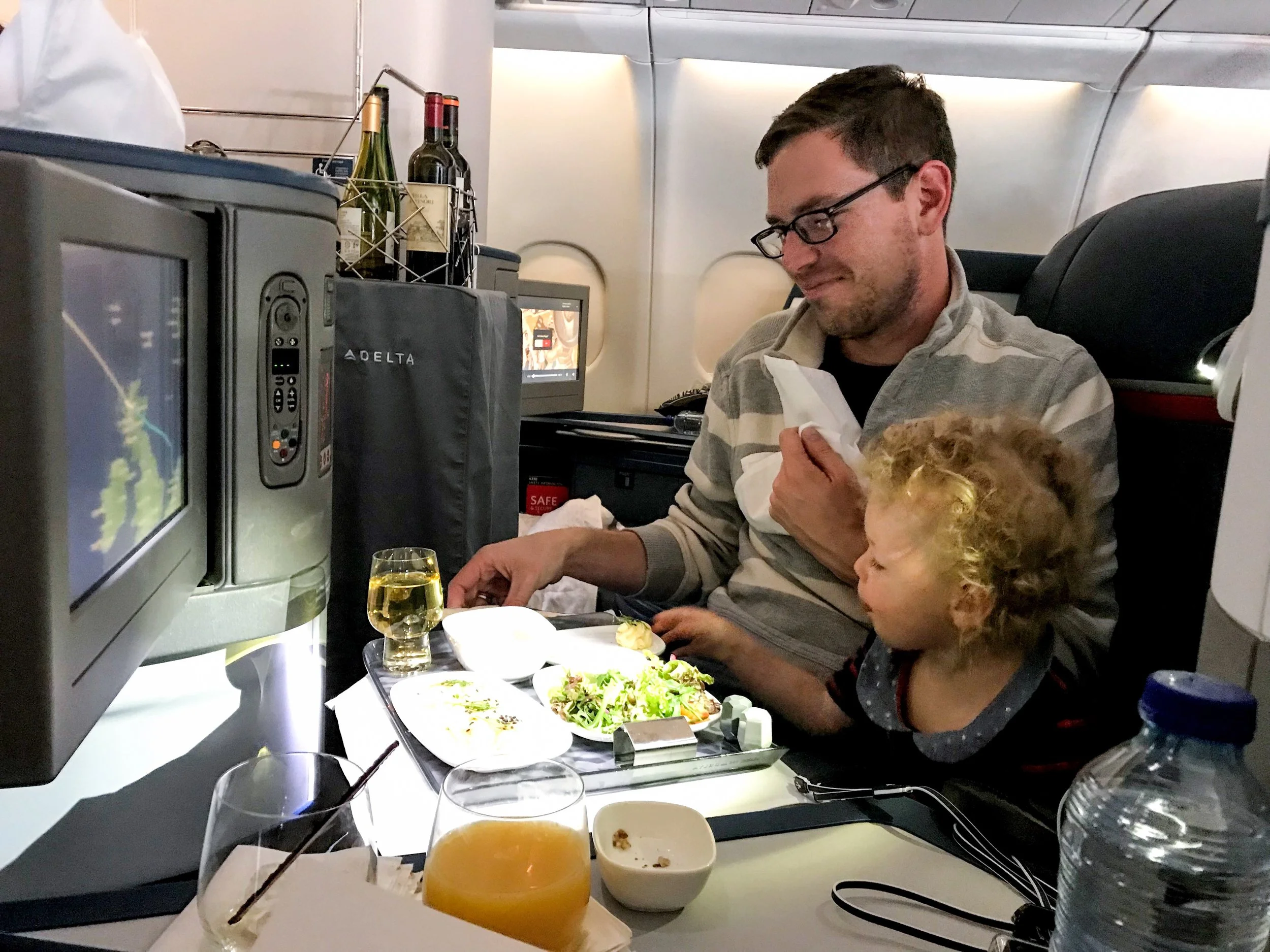 Drinks were initially served from a beverage cart during the meal. But after the meal was done, flight attendants walked around the cabin with bottles of wine.