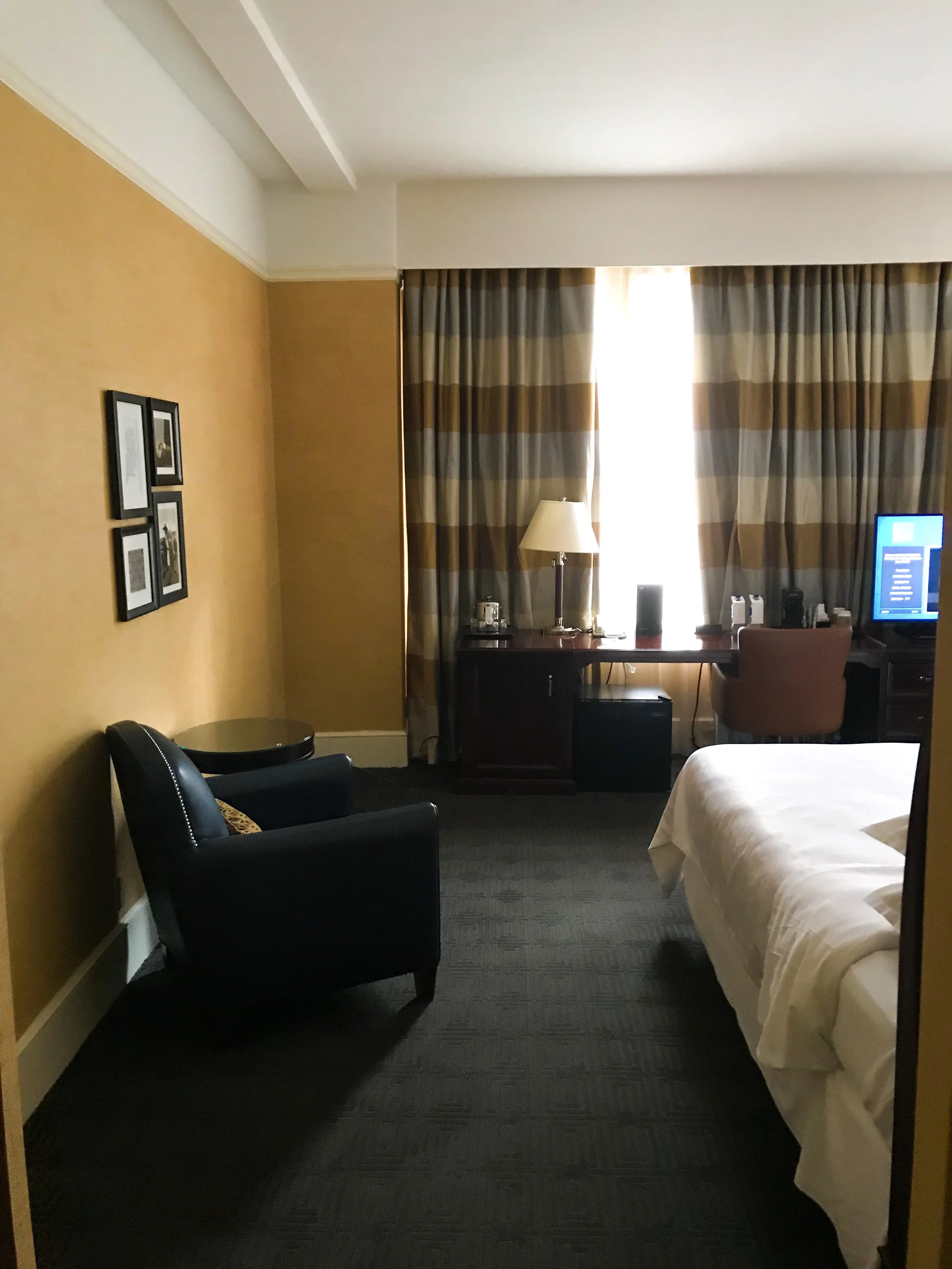 There was both a desk and a reading chair in the room.