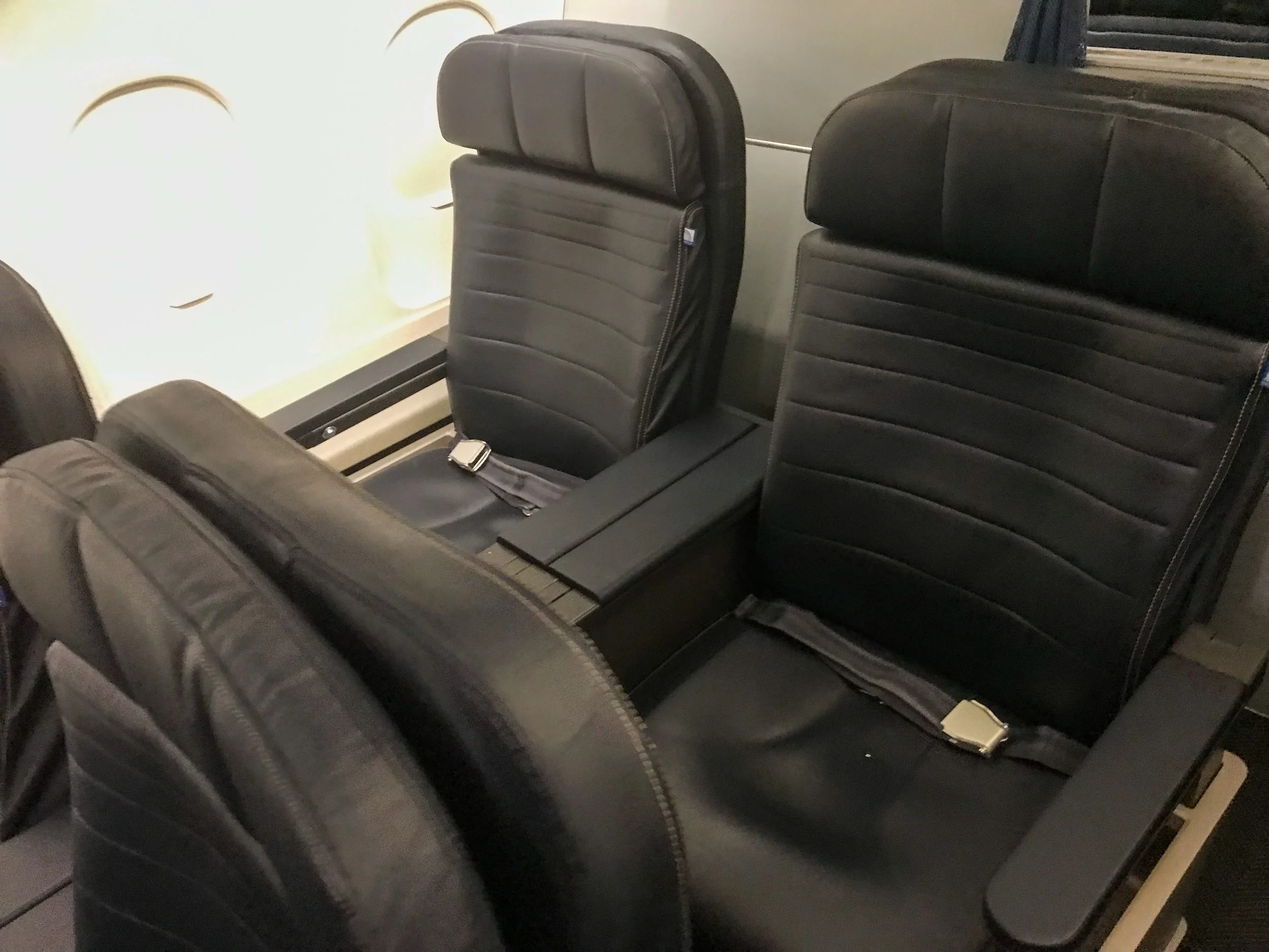 The United First cabin on the A319 has two rows of seats, separated from the main cabin by a hard bulkhead.