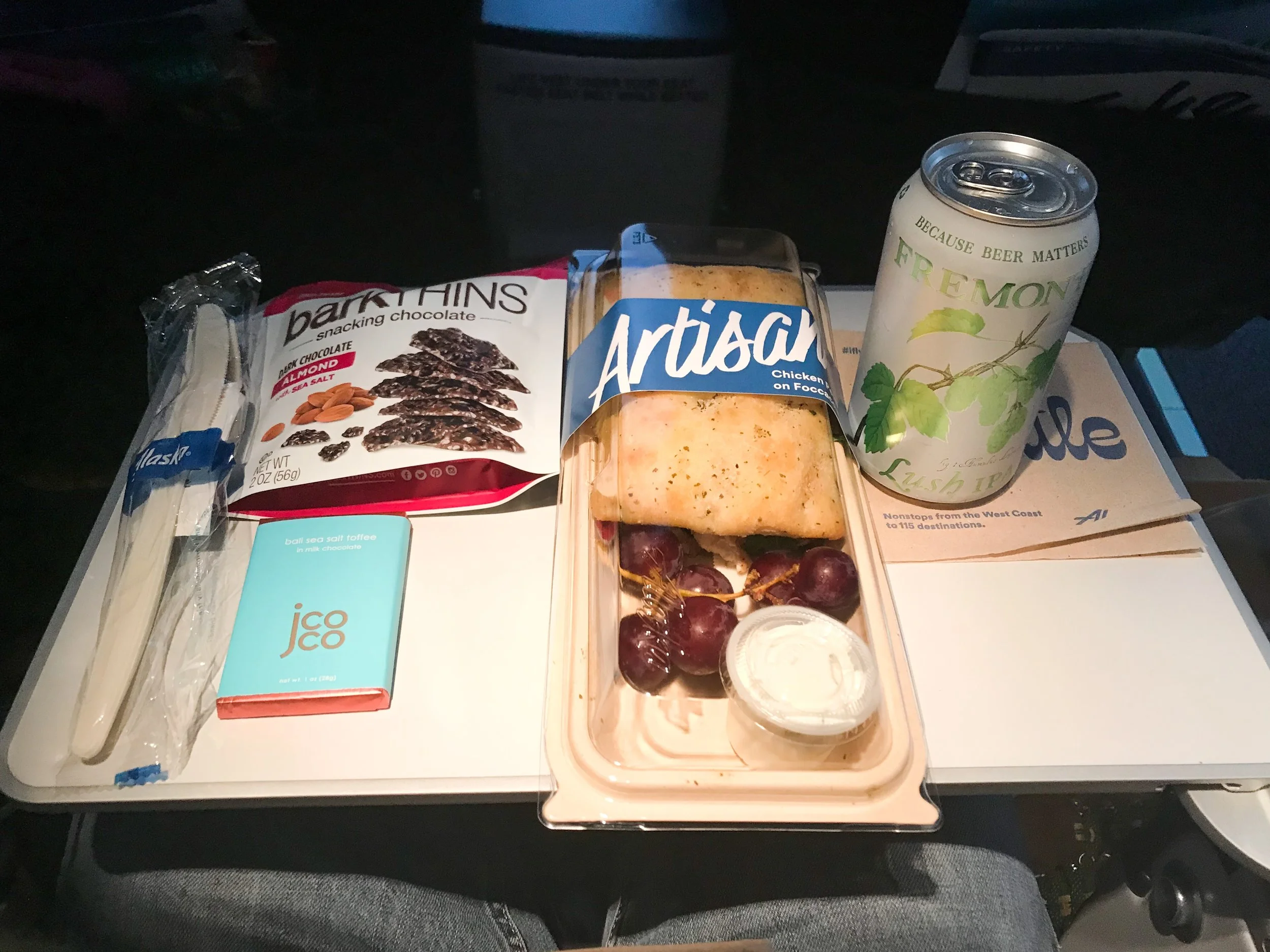 What a feast! Premium Class passengers receive complimentary alcoholic beverages and premium snacks (the barkthins). As an MVP Gold I also received the milk chocolate bar. The flight attendant thanked me for being a Gold member before handing it to me. I had pre-ordered the chicken pesto sandwich to give it a try. It wasn’t very good, especially for $9.50. The sandwich was very dry and kind of bland. I suggest spending that money for food at the airport or just bring your own, rather than paying for food onboard.